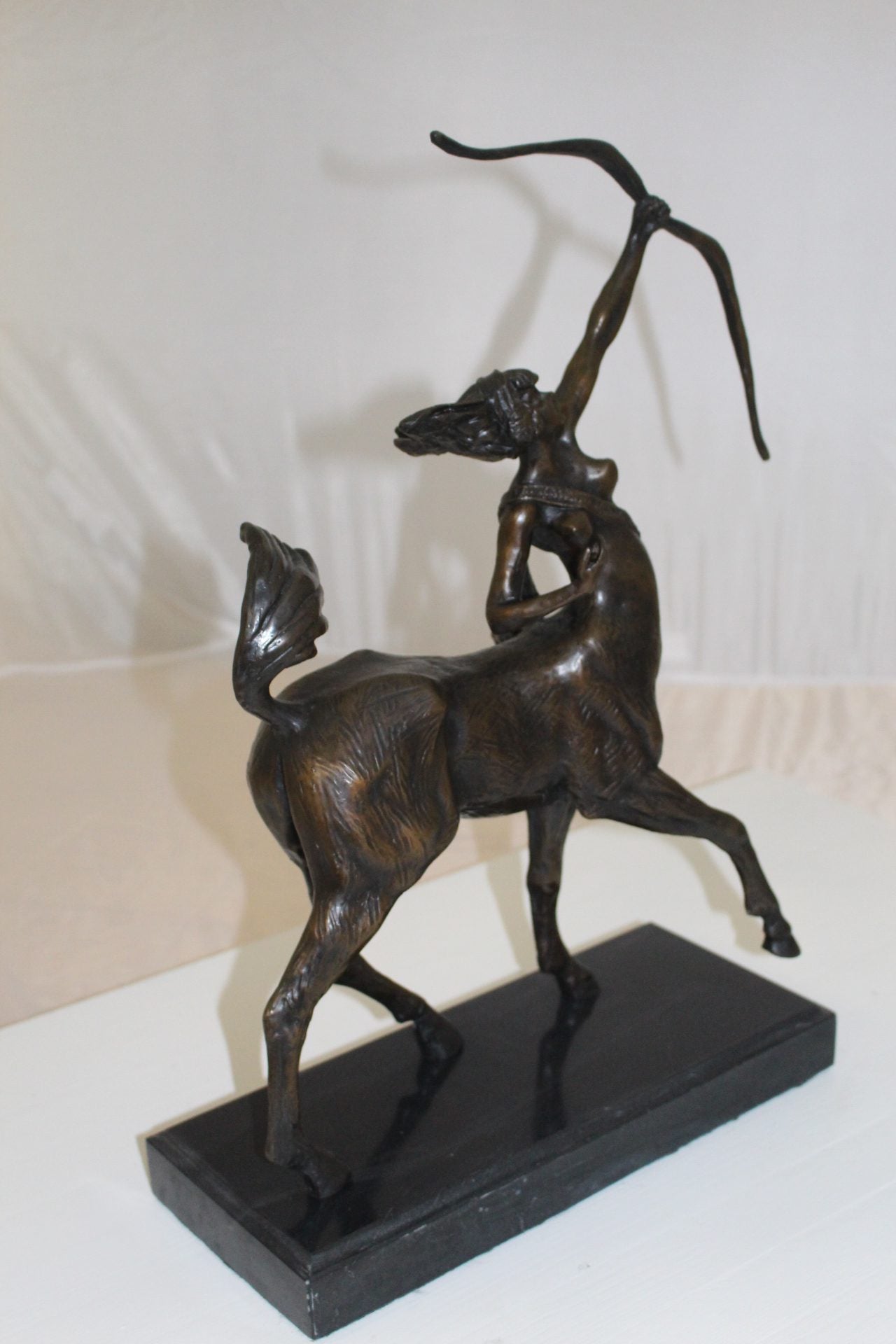 horse woman shooting an arrow Bronze Statue - Size: 14"L x 6"W x 20"H.