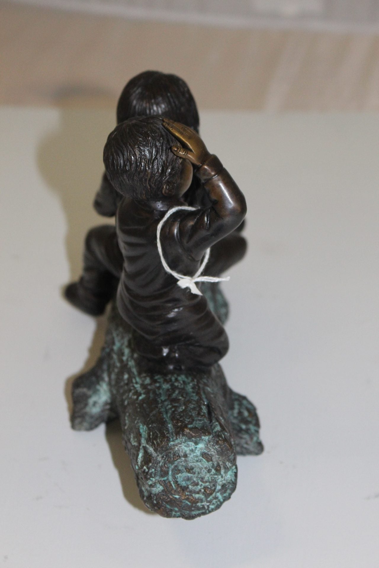 Two kids with dog on log Bronze Statue - Size: 12"L x 5"W x 8.5"H.