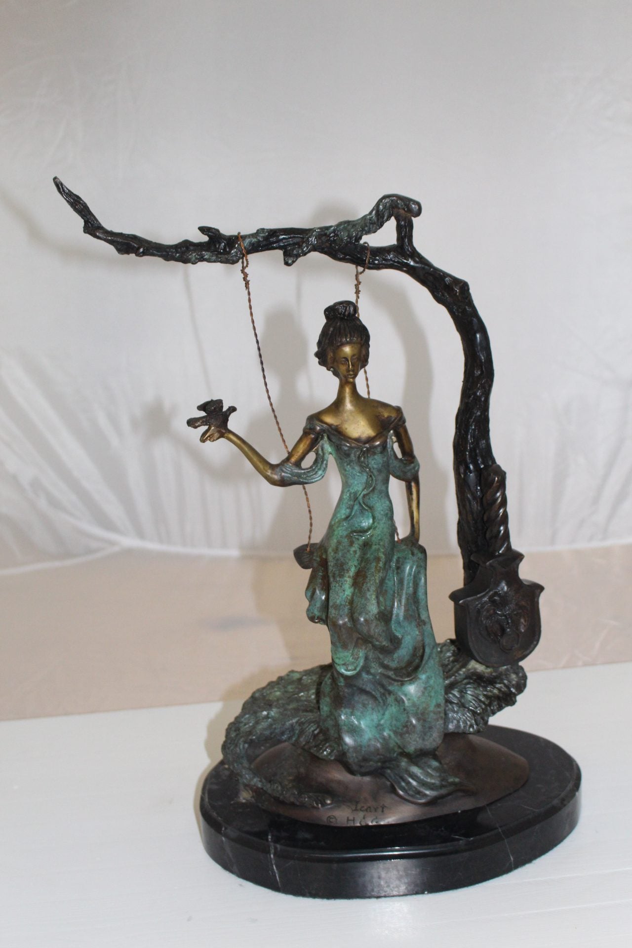 Girl on a swing Bronze Statue - Size: 15"L x 8"W x 21"H.