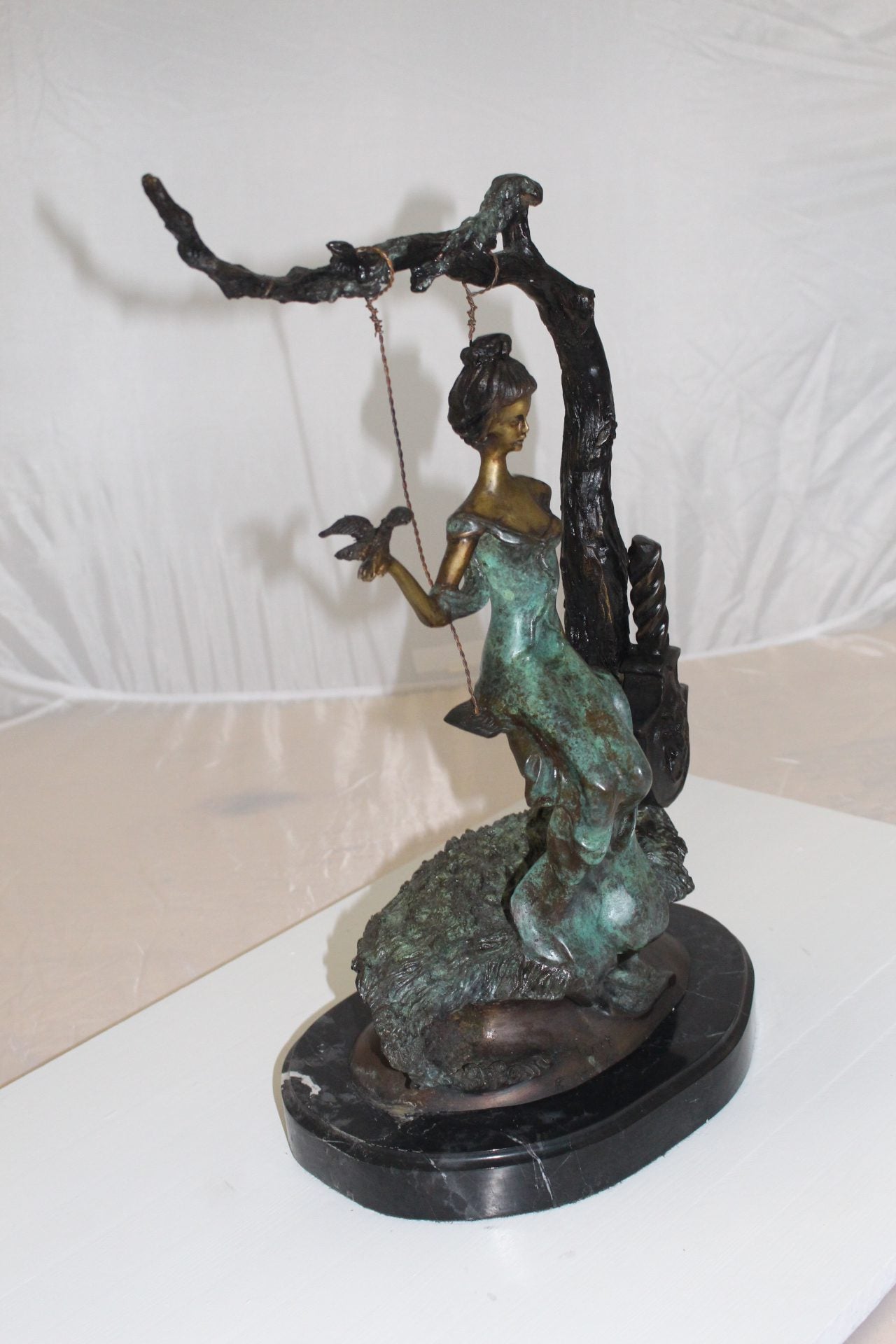 Girl on a swing Bronze Statue - Size: 15"L x 8"W x 21"H.