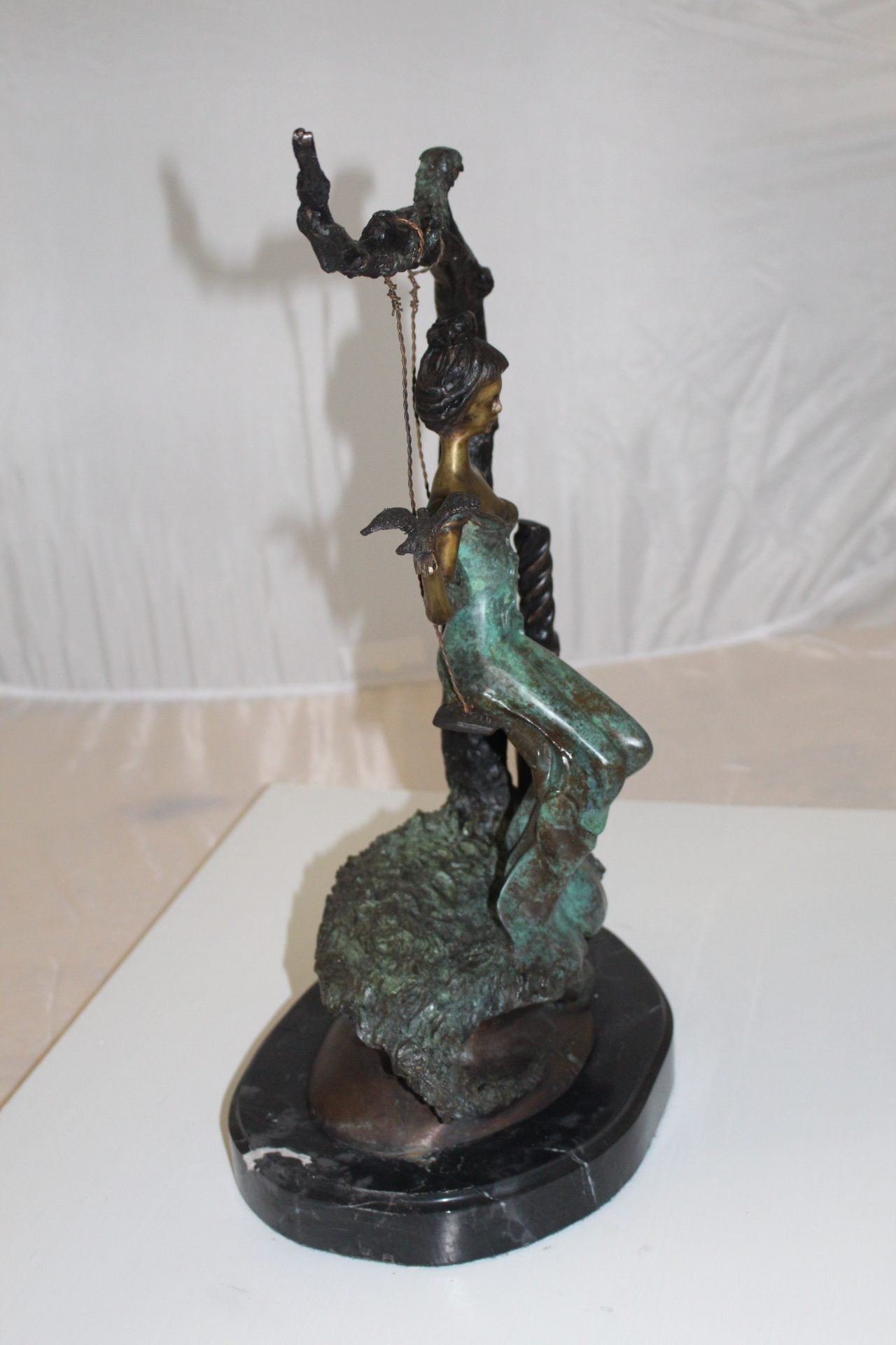 Girl on a swing Bronze Statue - Size: 15"L x 8"W x 21"H.