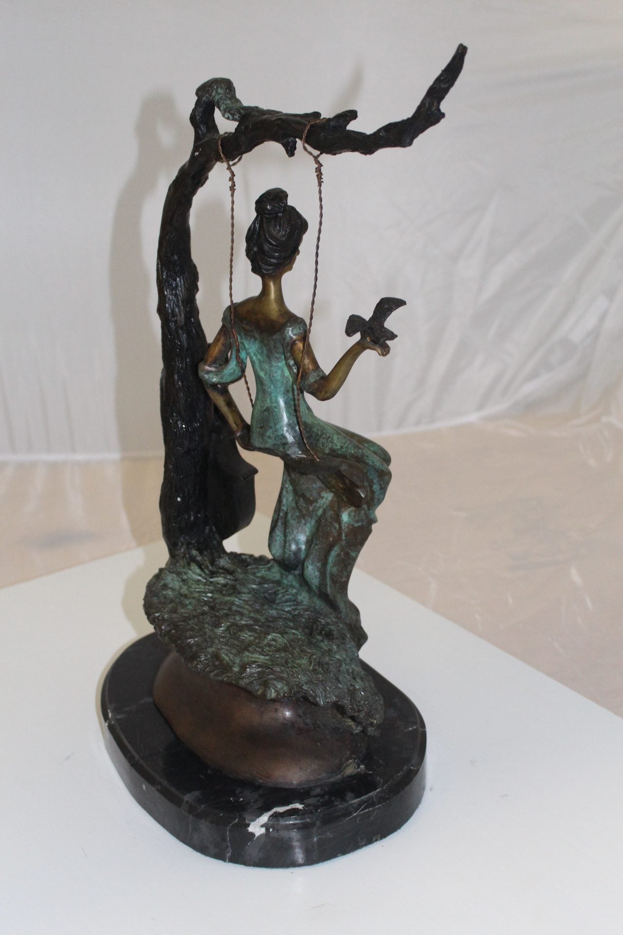 Girl on a swing Bronze Statue - Size: 15"L x 8"W x 21"H.