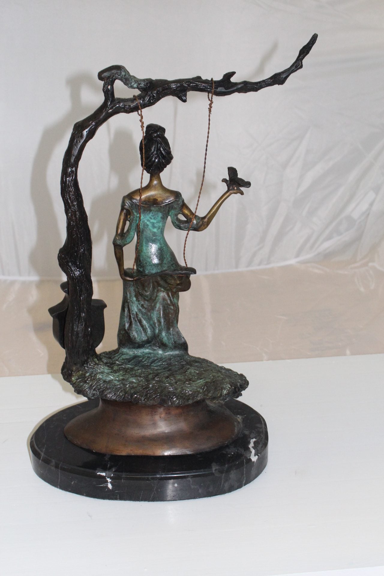 Girl on a swing Bronze Statue - Size: 15"L x 8"W x 21"H.