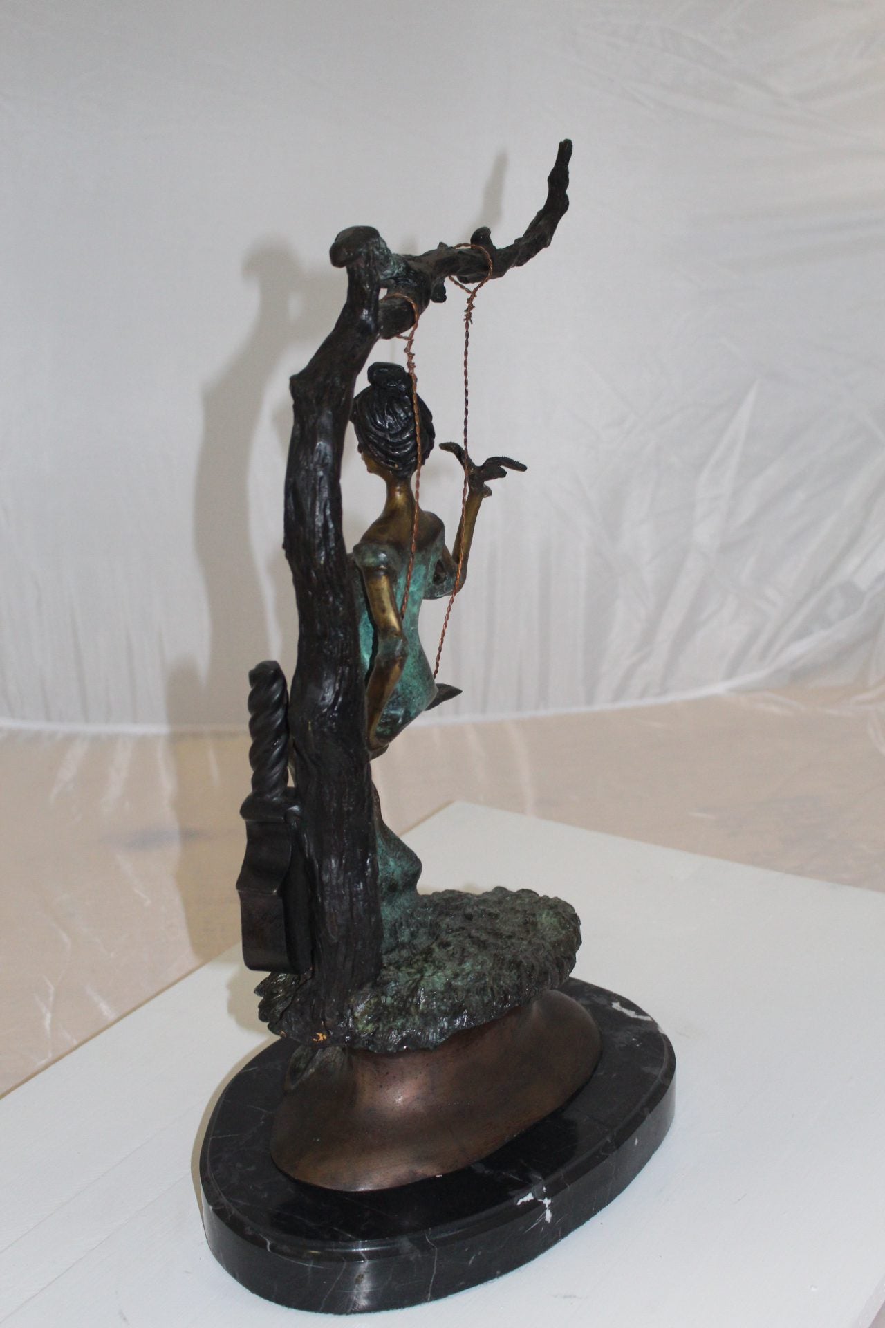 Girl on a swing Bronze Statue - Size: 15"L x 8"W x 21"H.