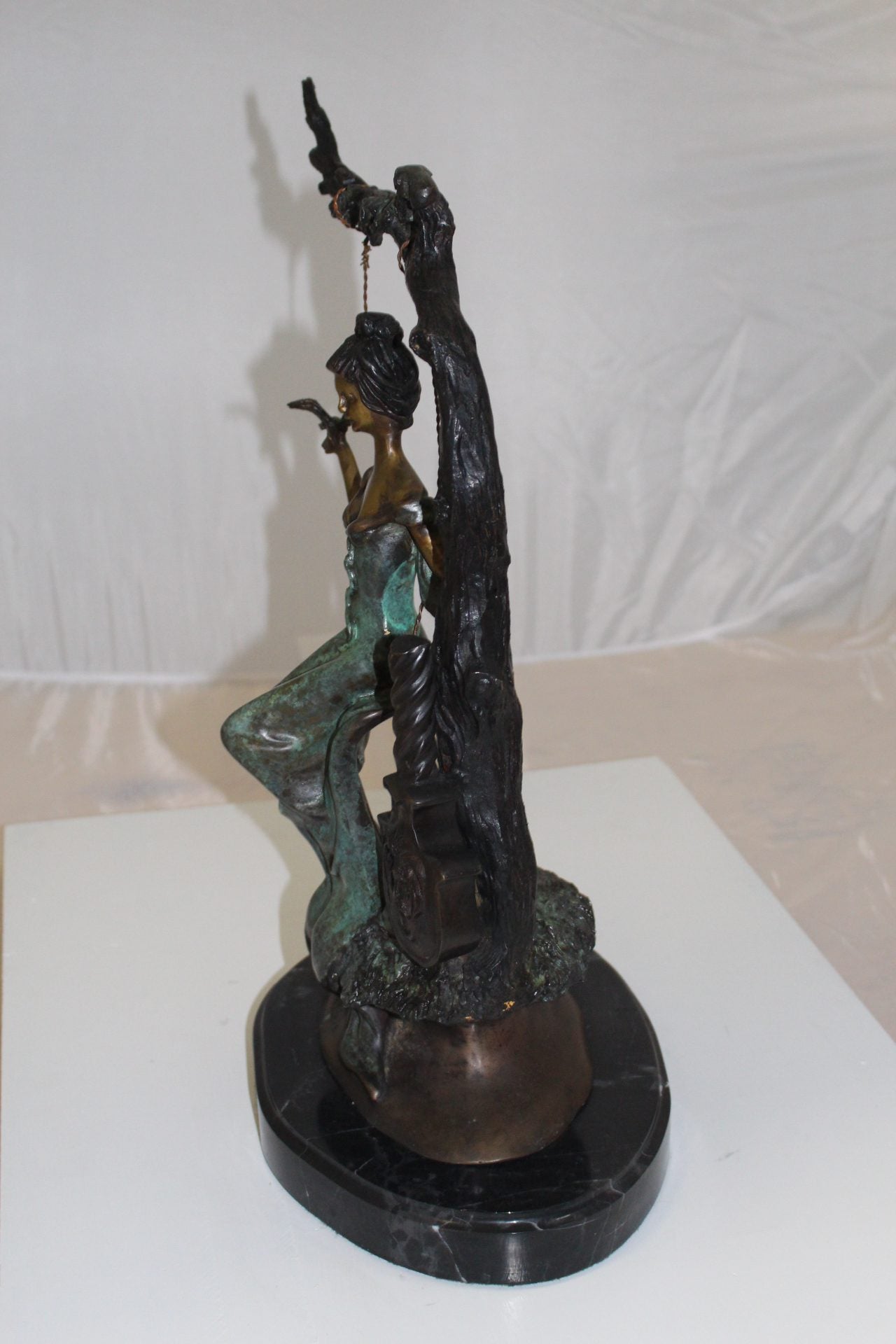 Girl on a swing Bronze Statue - Size: 15"L x 8"W x 21"H.