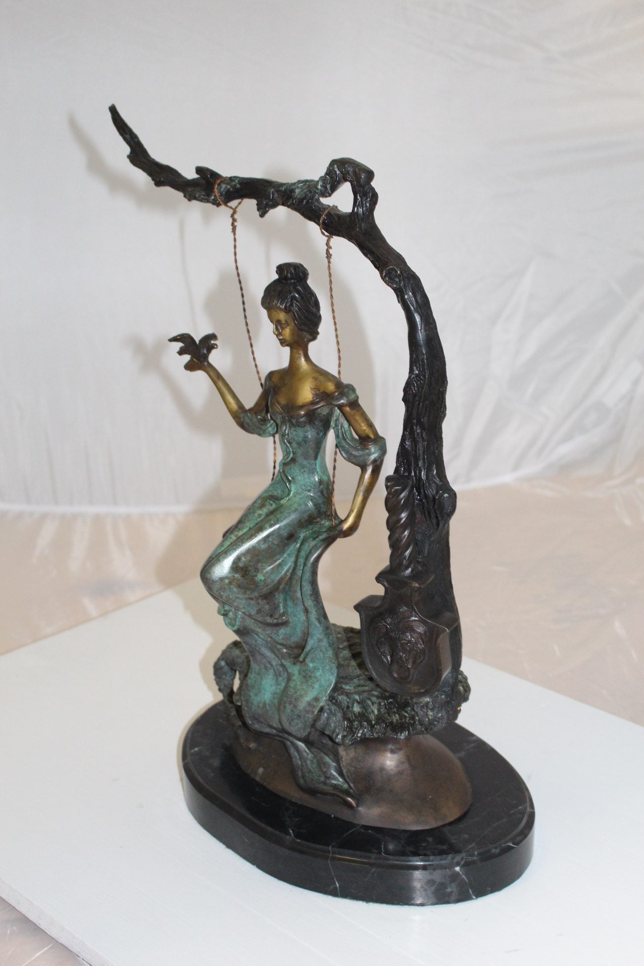 Girl on a swing Bronze Statue - Size: 15"L x 8"W x 21"H.