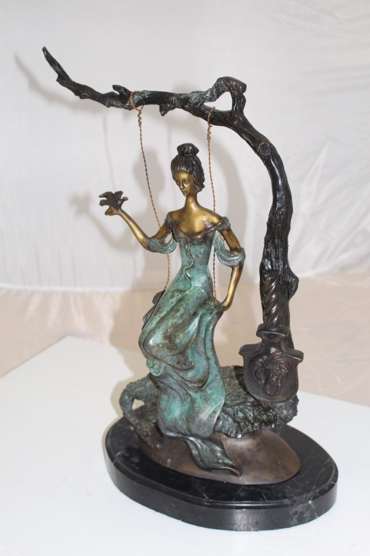Girl on a swing Bronze Statue - Size: 15"L x 8"W x 21"H.
