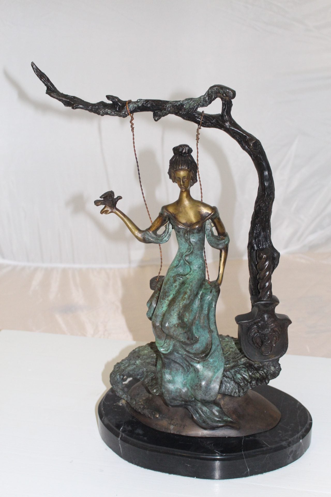 Girl on a swing Bronze Statue - Size: 15"L x 8"W x 21"H.