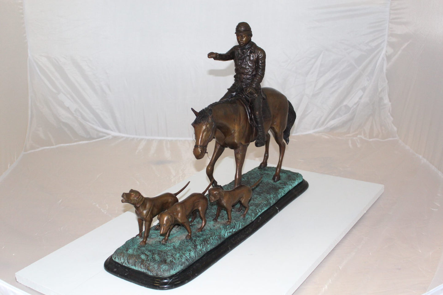 Hunter with 3 dogs Bronze Statue - Size: 26"L x 8"W x 19"H.