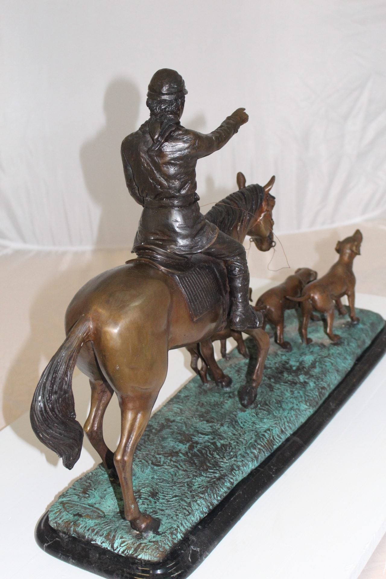 Hunter with 3 dogs Bronze Statue - Size: 26"L x 8"W x 19"H.