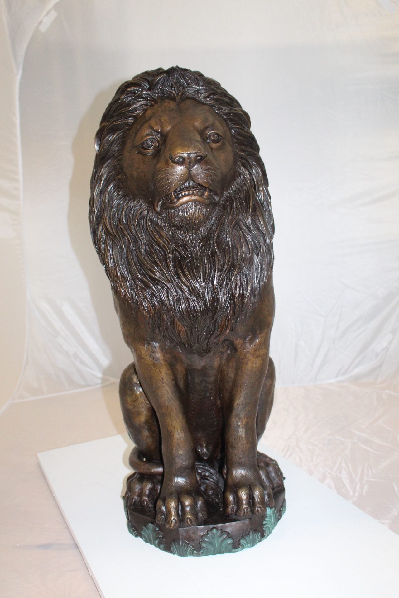 Lion Sitting on Base Bronze Statue - Size: 13"L x 13"W x 34"H.