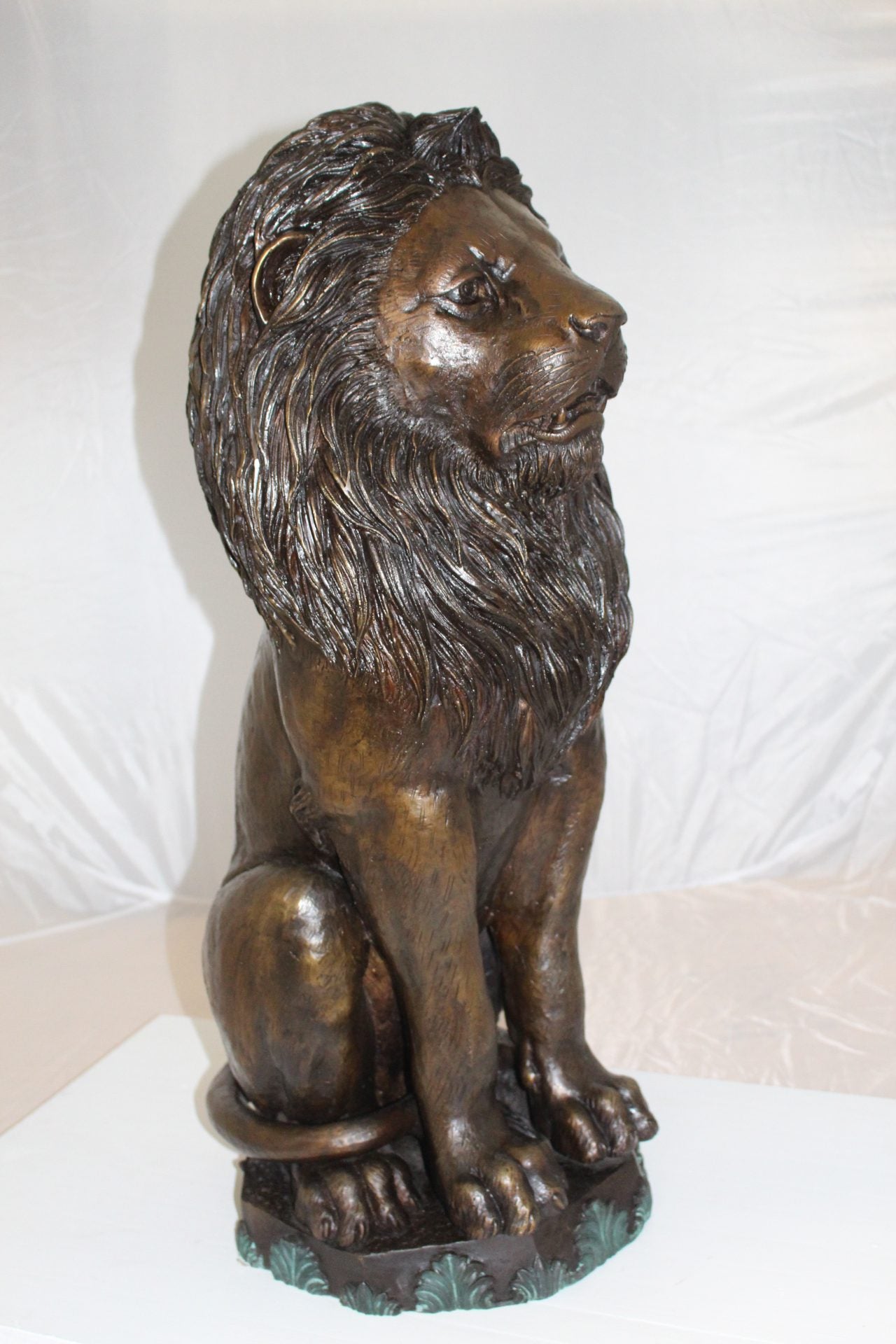 Lion Sitting on Base Bronze Statue -  Size: 13"L x 13"W x 34"H.