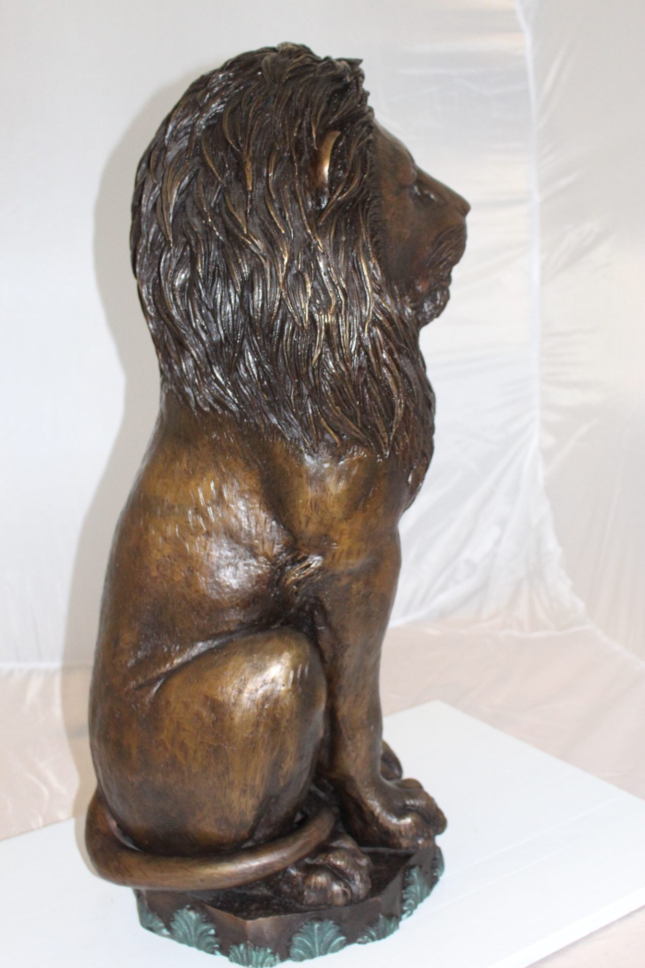 Lion Sitting on Base Bronze Statue -  Size: 13"L x 13"W x 34"H.