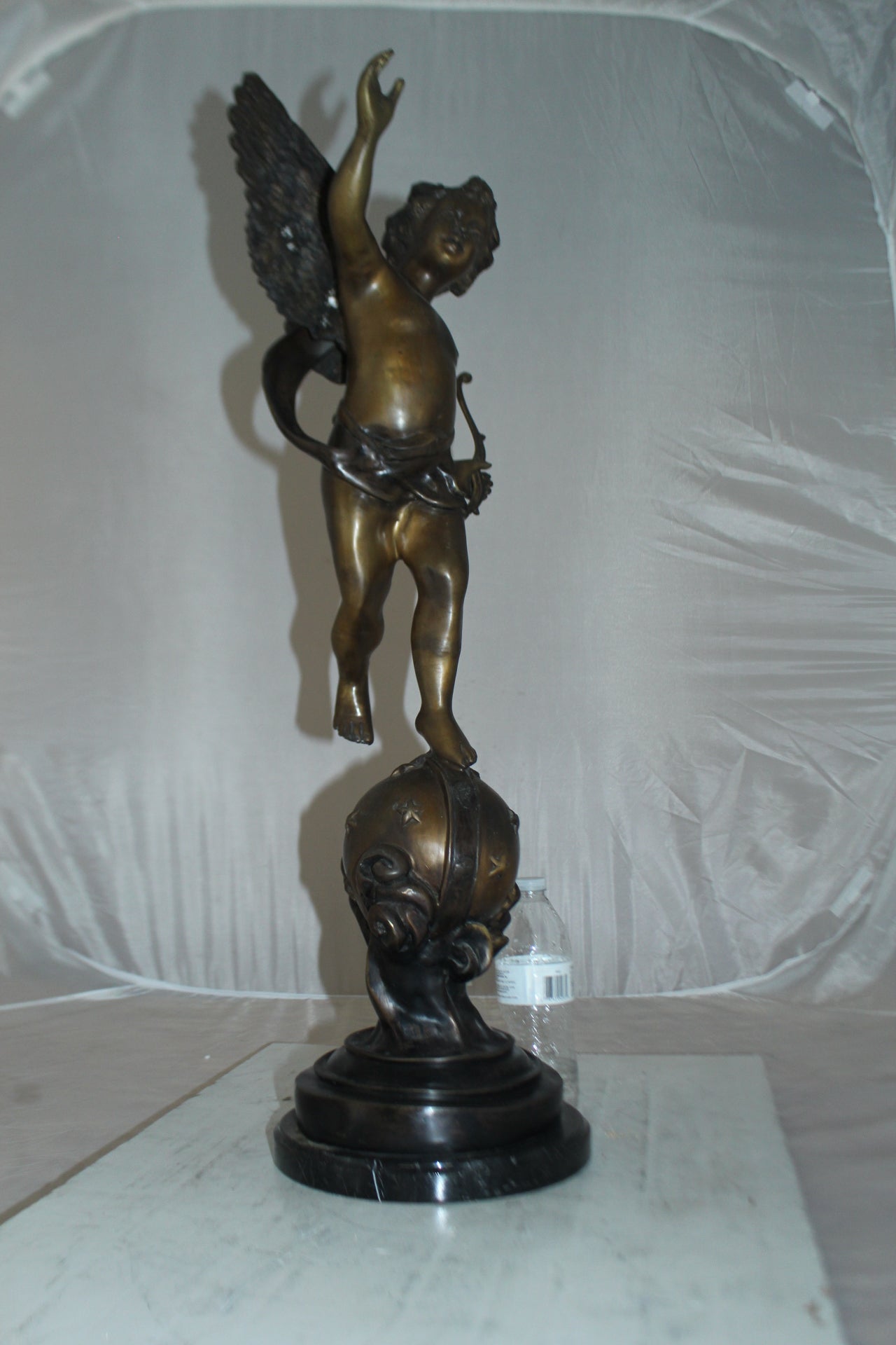 Angel on Earth Bronze Statue - Size: 10"L x 13"W x 32"H.