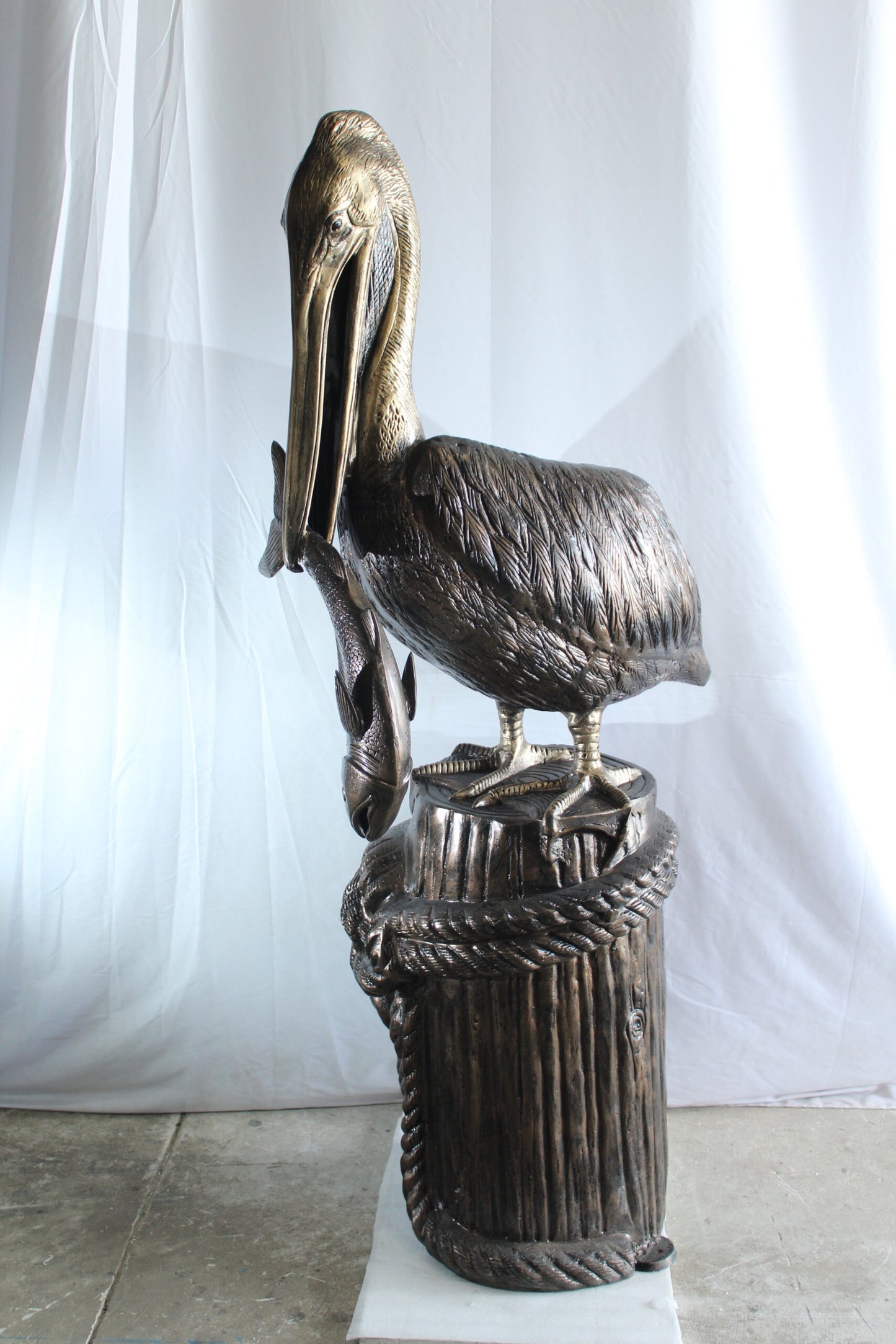 Giant Aluminum Pelican Statue Catching Fish on Dock Post 40" x 33" x 78"H