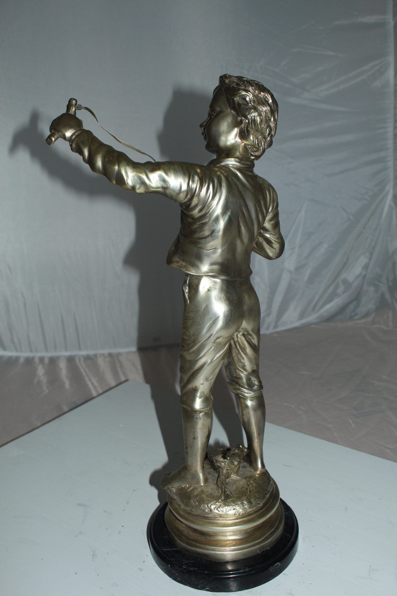 Boy with a Sling Bronze Statue -  Size: 10"L x 6.5"W x 21.5"H.