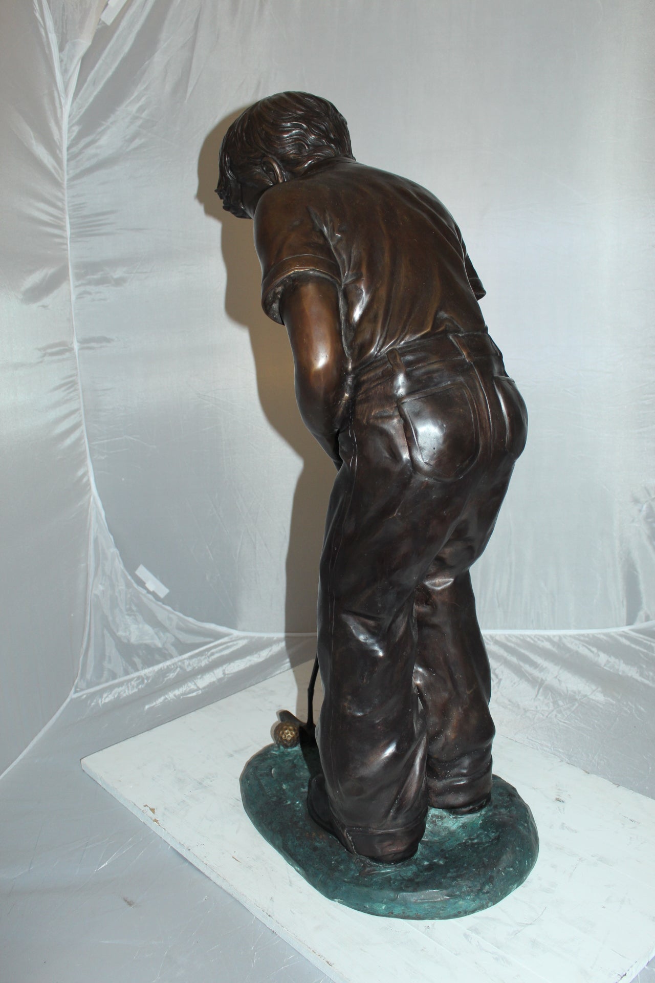 Boy plays golf Bronze Statue -  Size: 14"L x 18"W x 37"H.