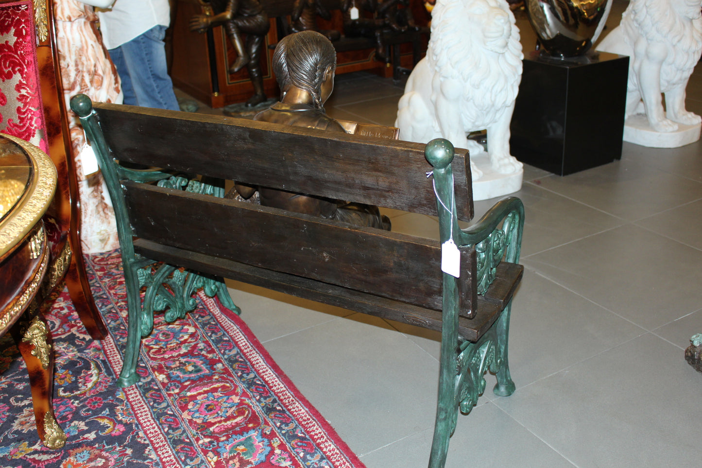 Girl sitting with her dog on a bench, reading Bronze Statue - 27" x 39" x 32"H