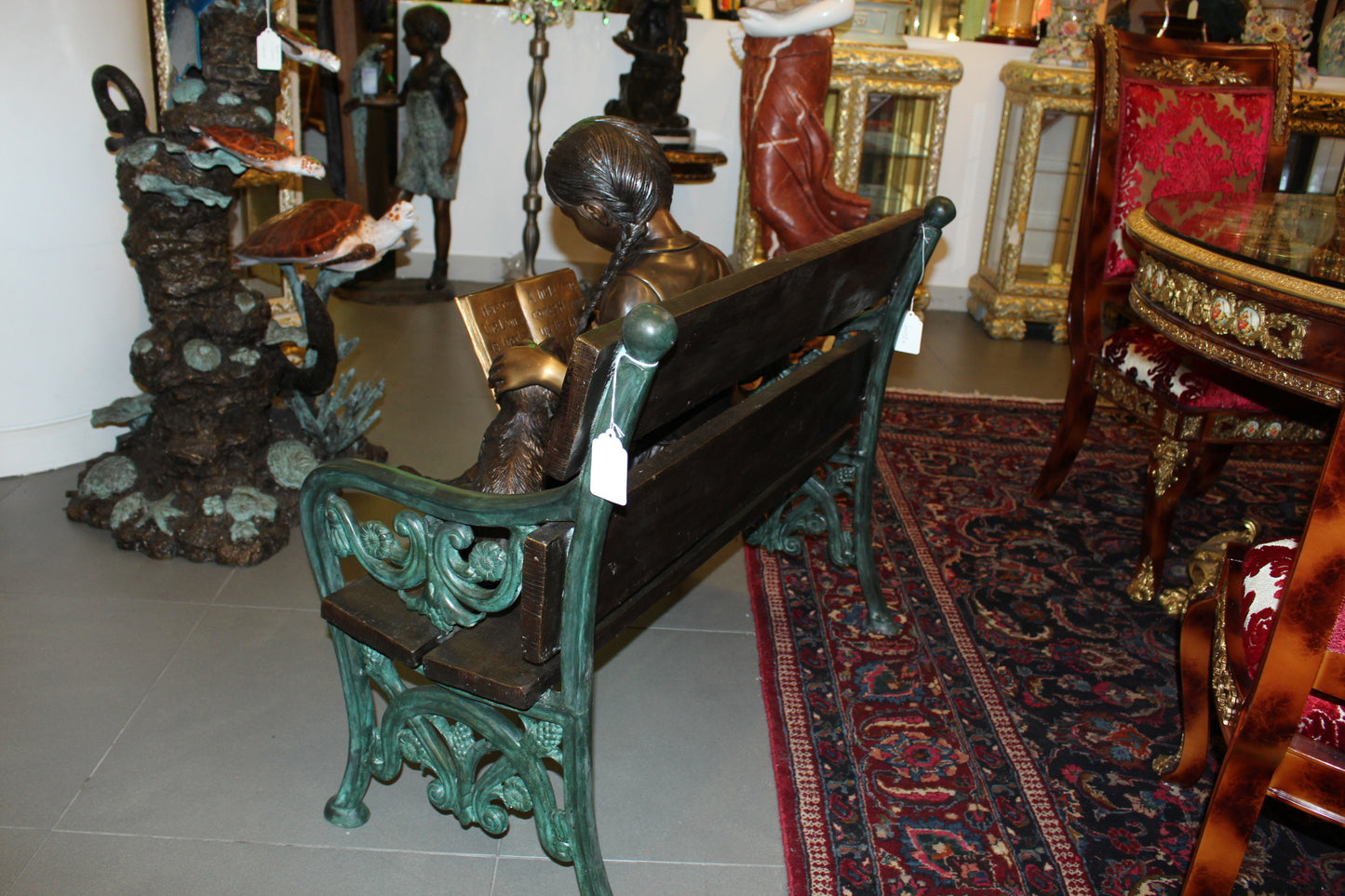 Girl sitting with her dog on a bench, reading Bronze Statue - 27" x 39" x 32"H