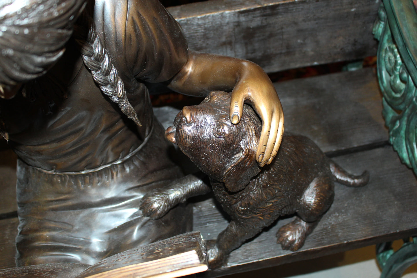 Girl sitting with her dog on a bench, reading Bronze Statue - 27" x 39" x 32"H