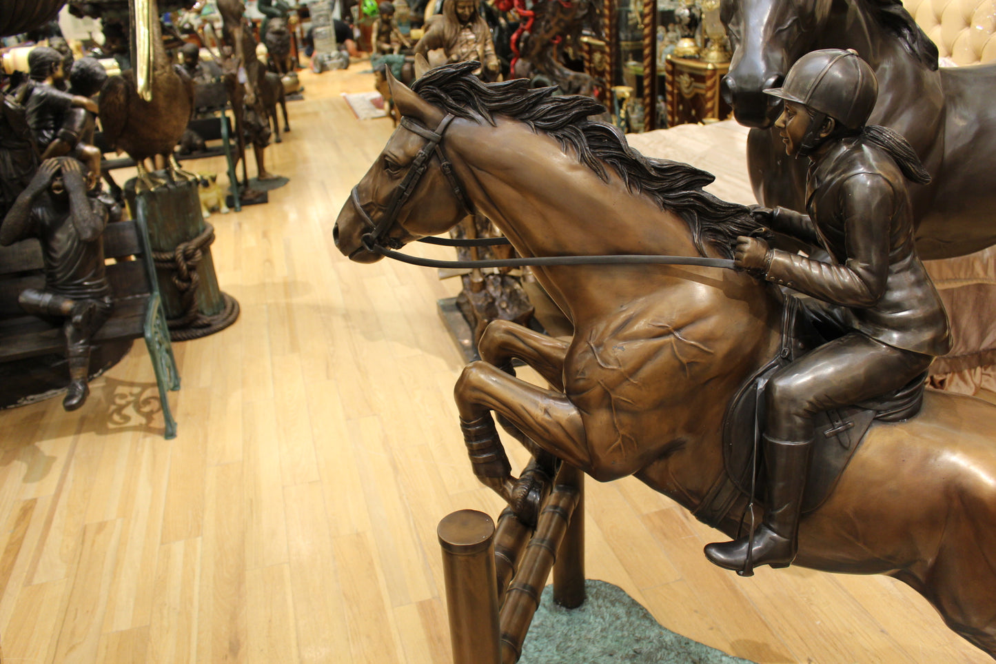 Jockey and Horse Jump a Fence Bronze Statue -  Size: 60"L x 30"W x 51"H.