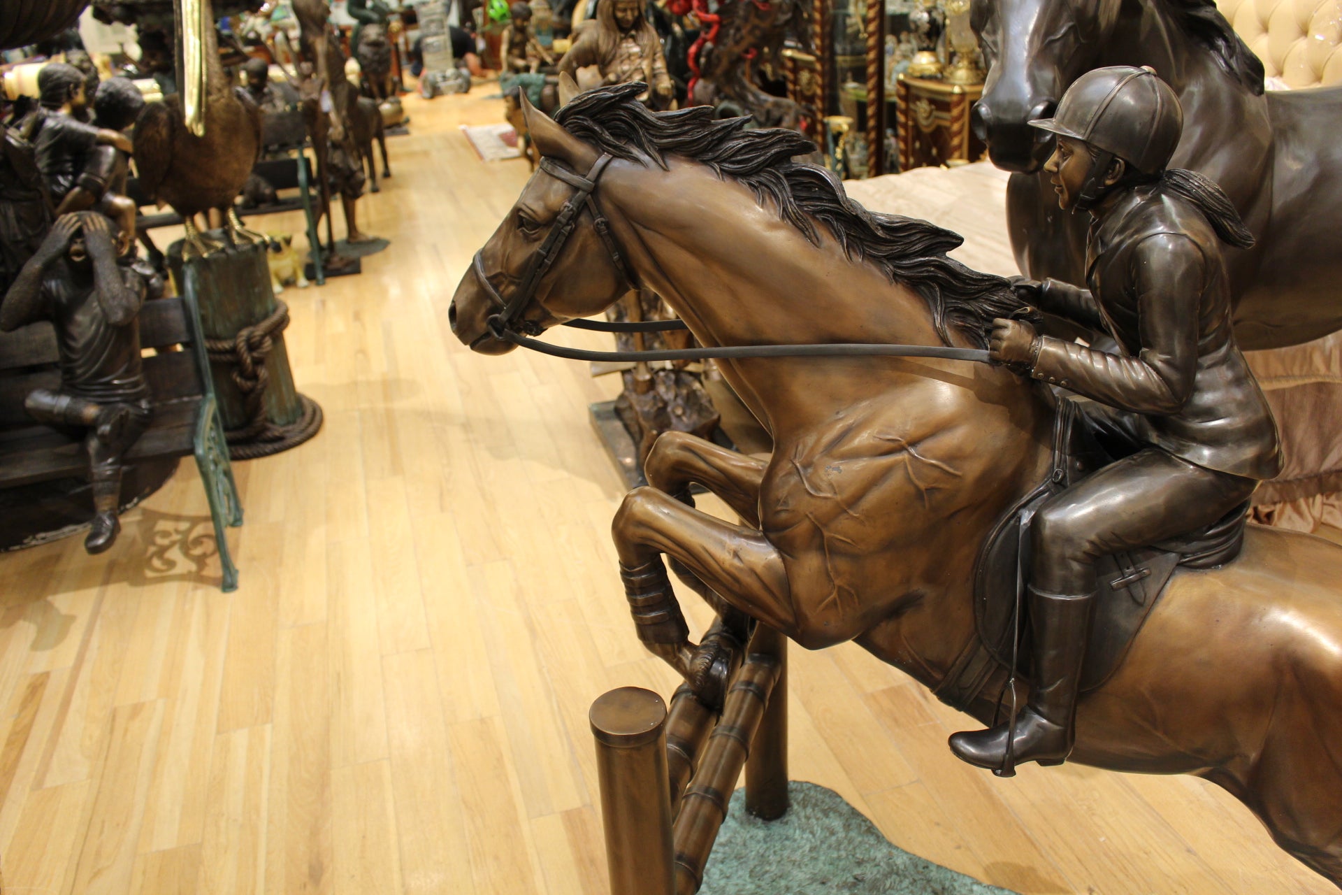 Jockey and Horse Jump a Fence Bronze Statue -  Size: 60"L x 30"W x 51"H.