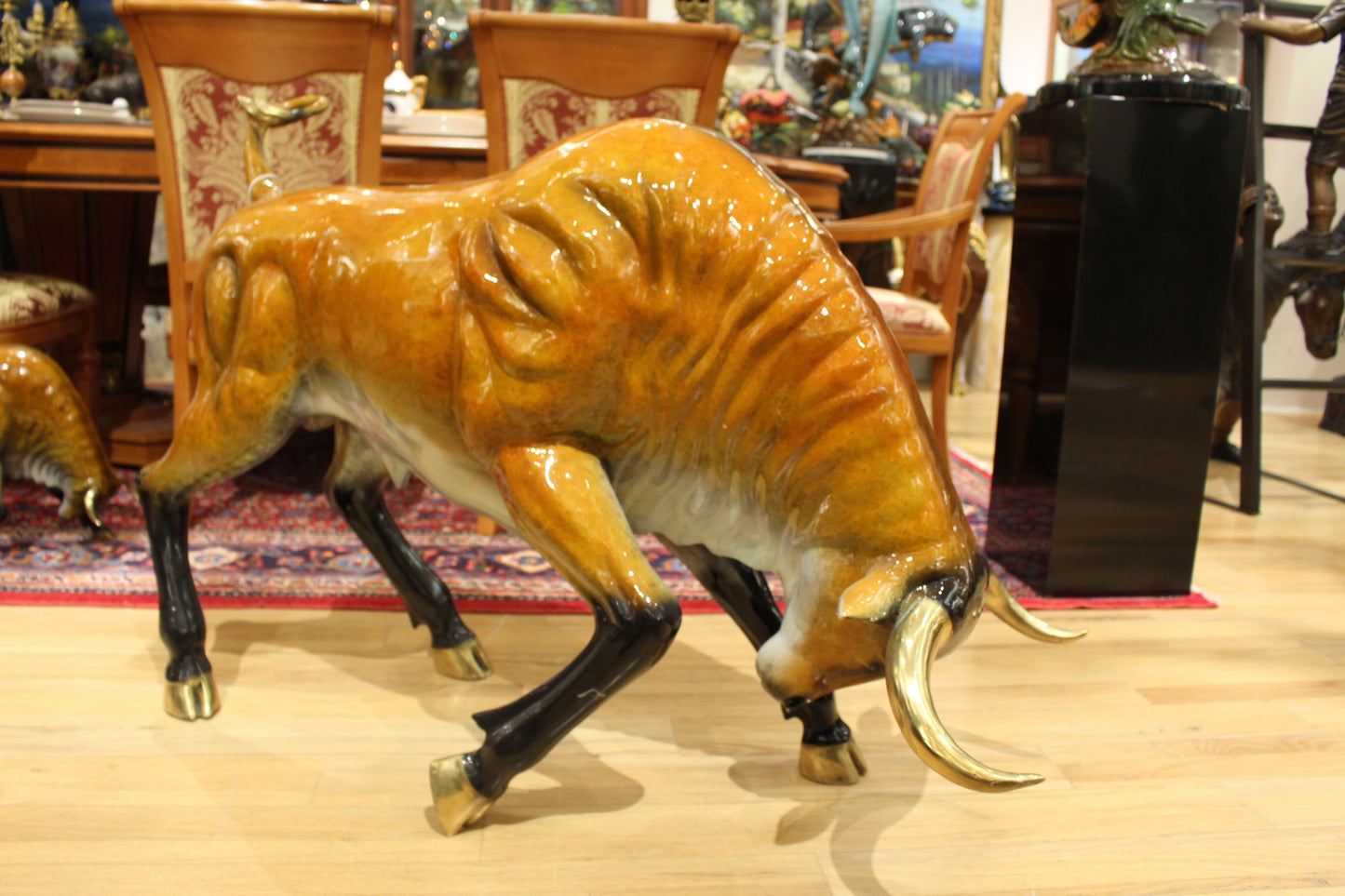 Bull Heads Down -Large Bronze Statue - Size: 48"L x 12"W x 30"H.