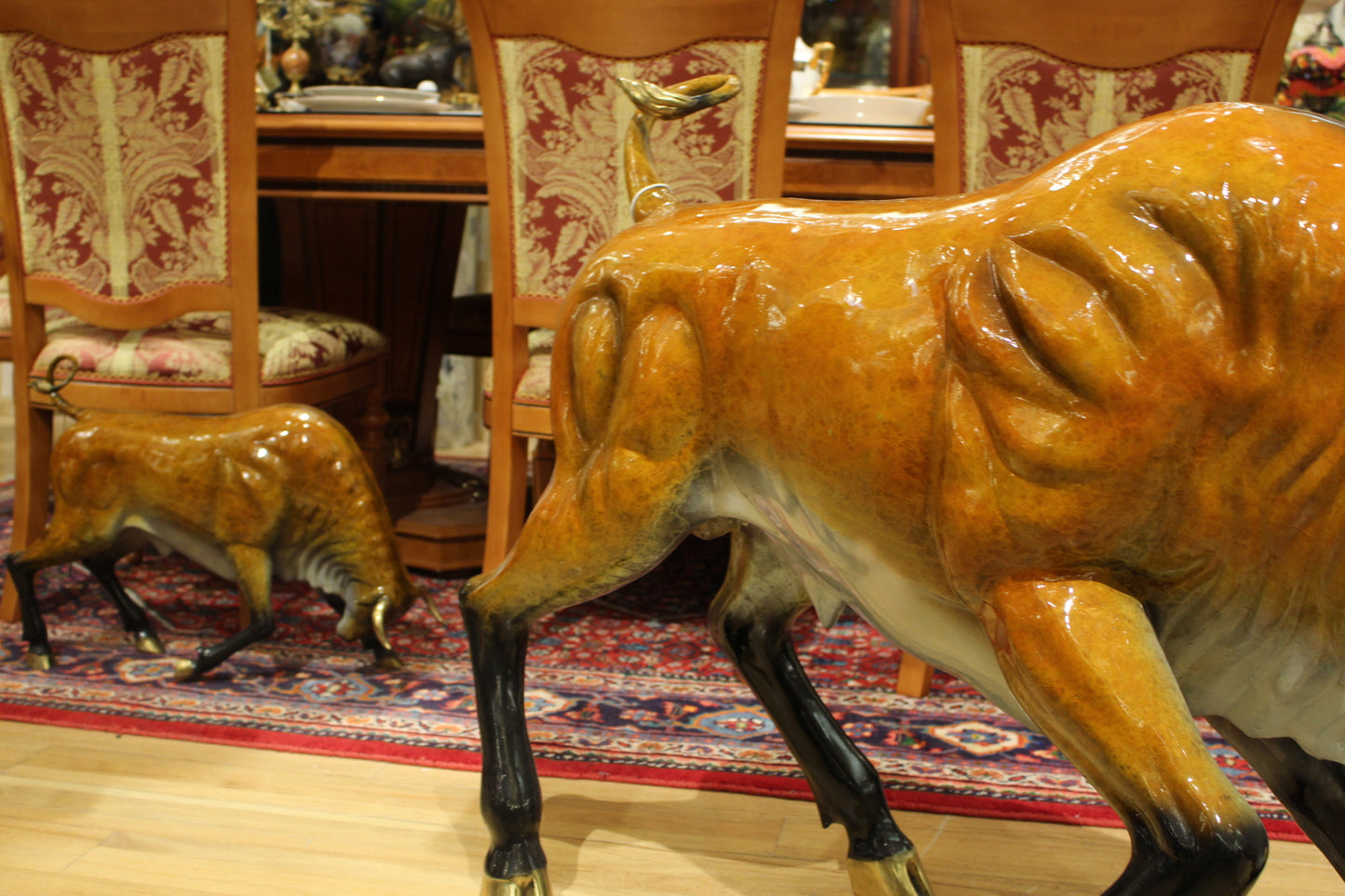 Bull Heads Down -Large Bronze Statue - Size: 48"L x 12"W x 30"H.