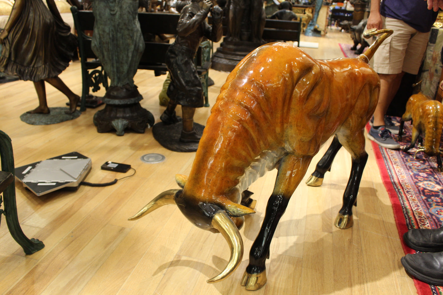 Bull Heads Down -Large Bronze Statue - Size: 48"L x 12"W x 30"H.