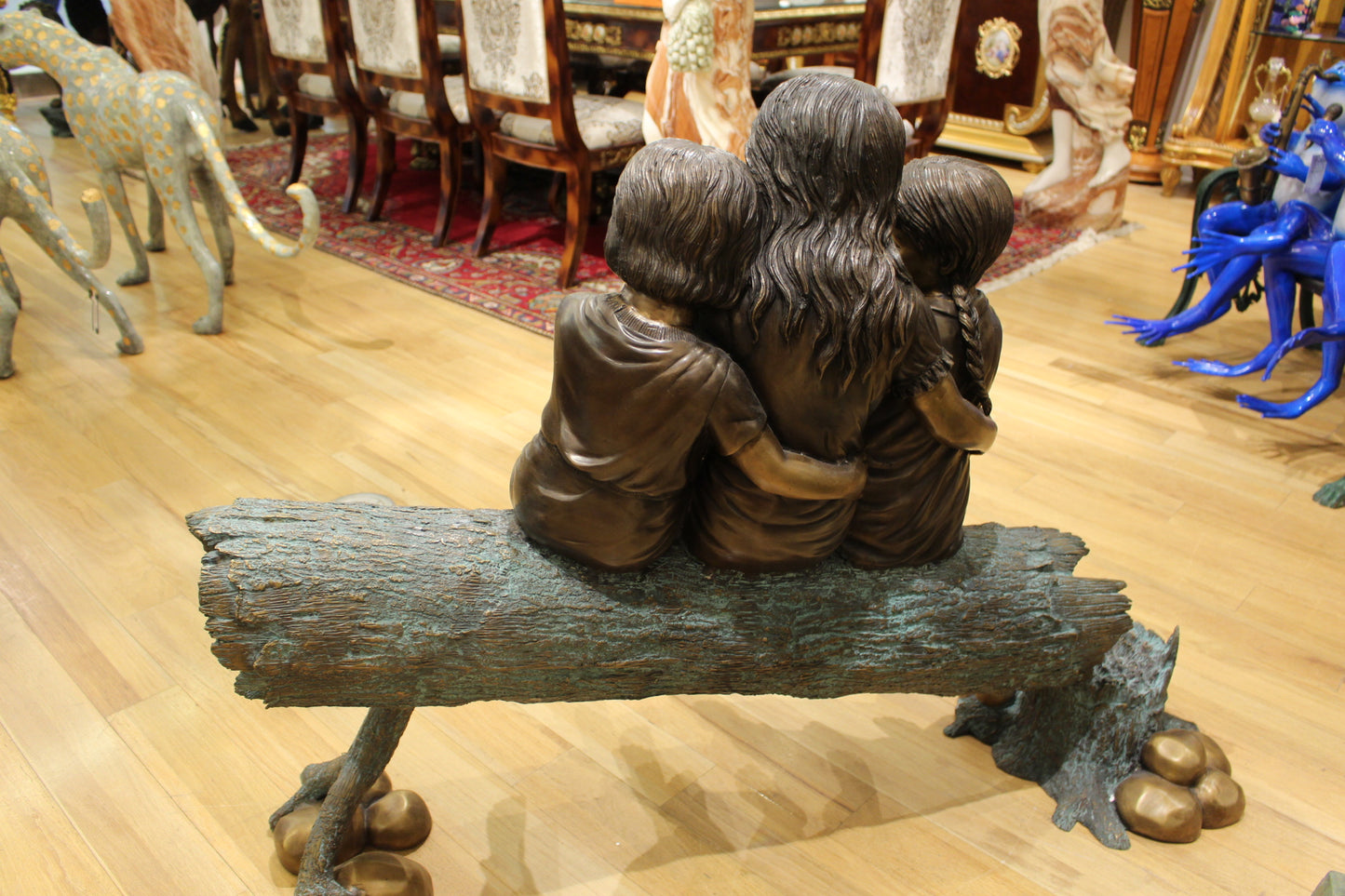 Three Children On Log Holding Bird Bronze Statue - Size: 55"L x 18"W x 38"H.