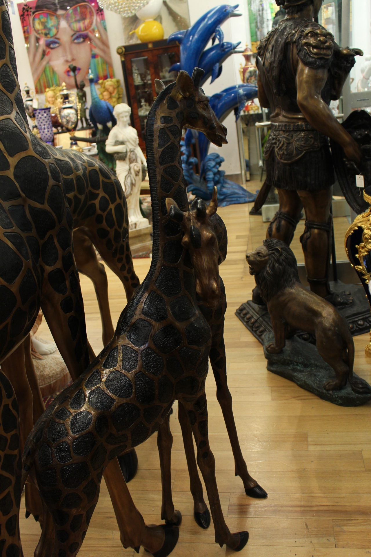 Pair of Giraffes Bronze Statues -  Size: 32"L x 12"W x 55"H.