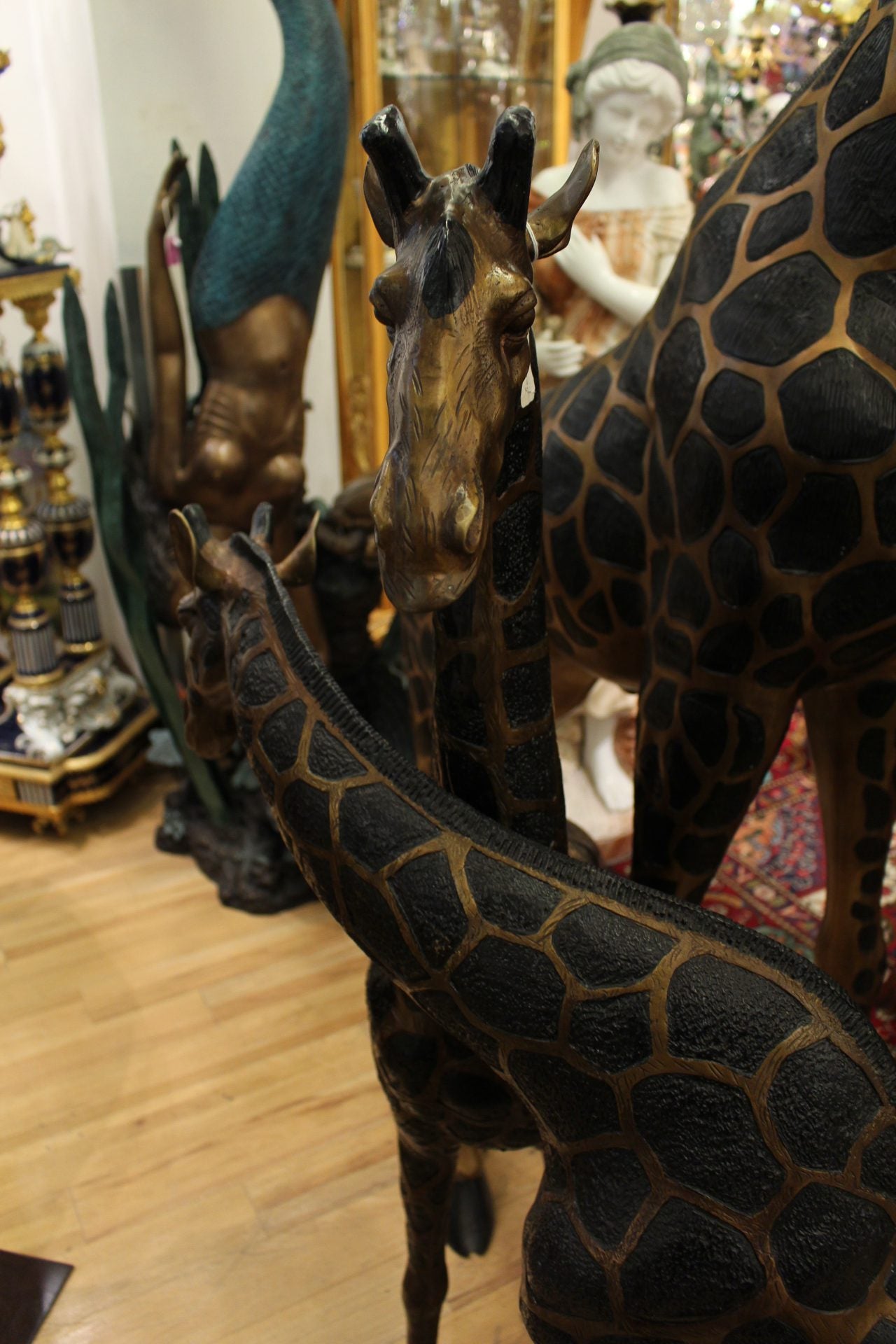 Pair of Giraffes Bronze Statues -  Size: 32"L x 12"W x 55"H.