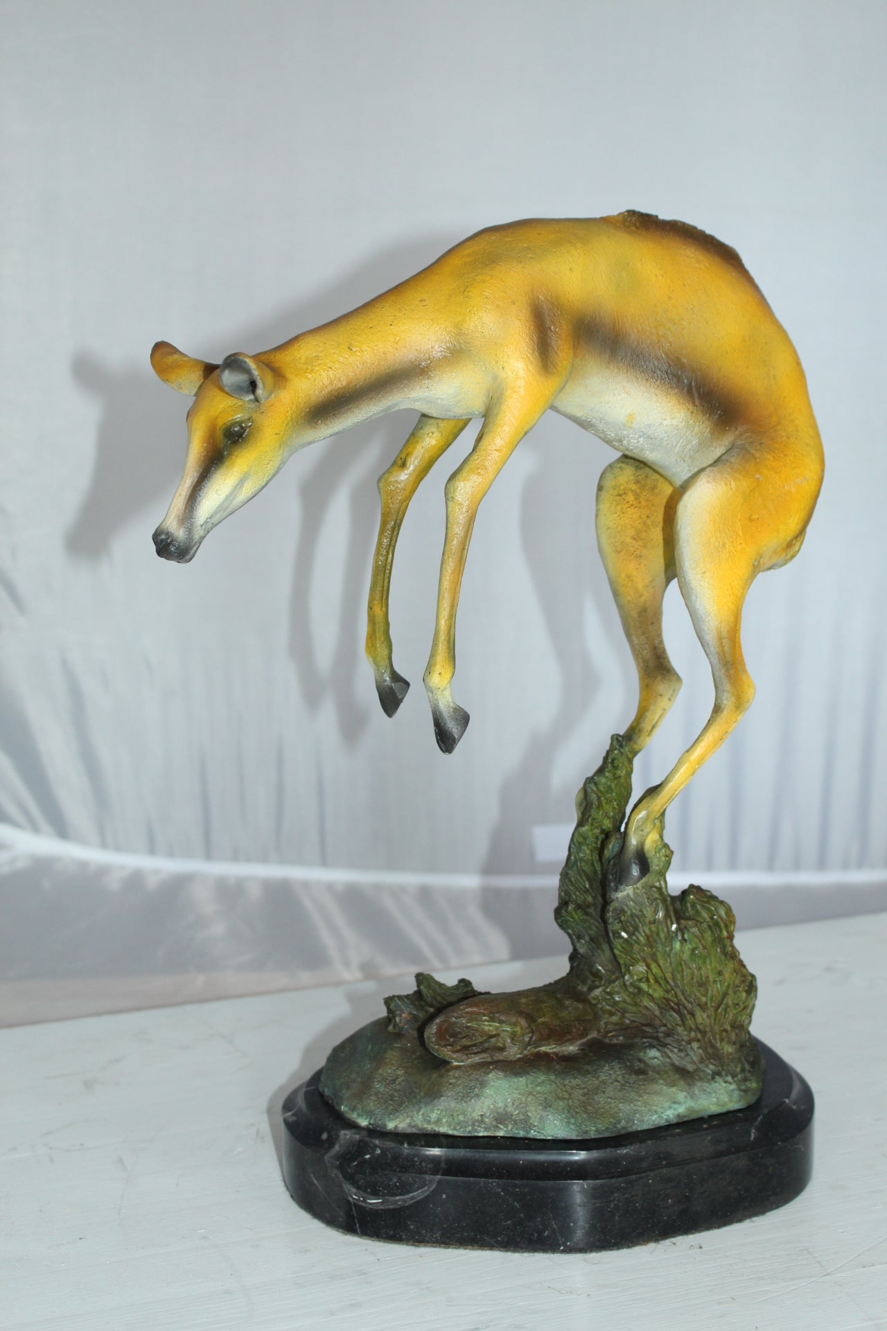 Jumping Impala bronze statue - Size: 9"L x 7"W x 16"H.