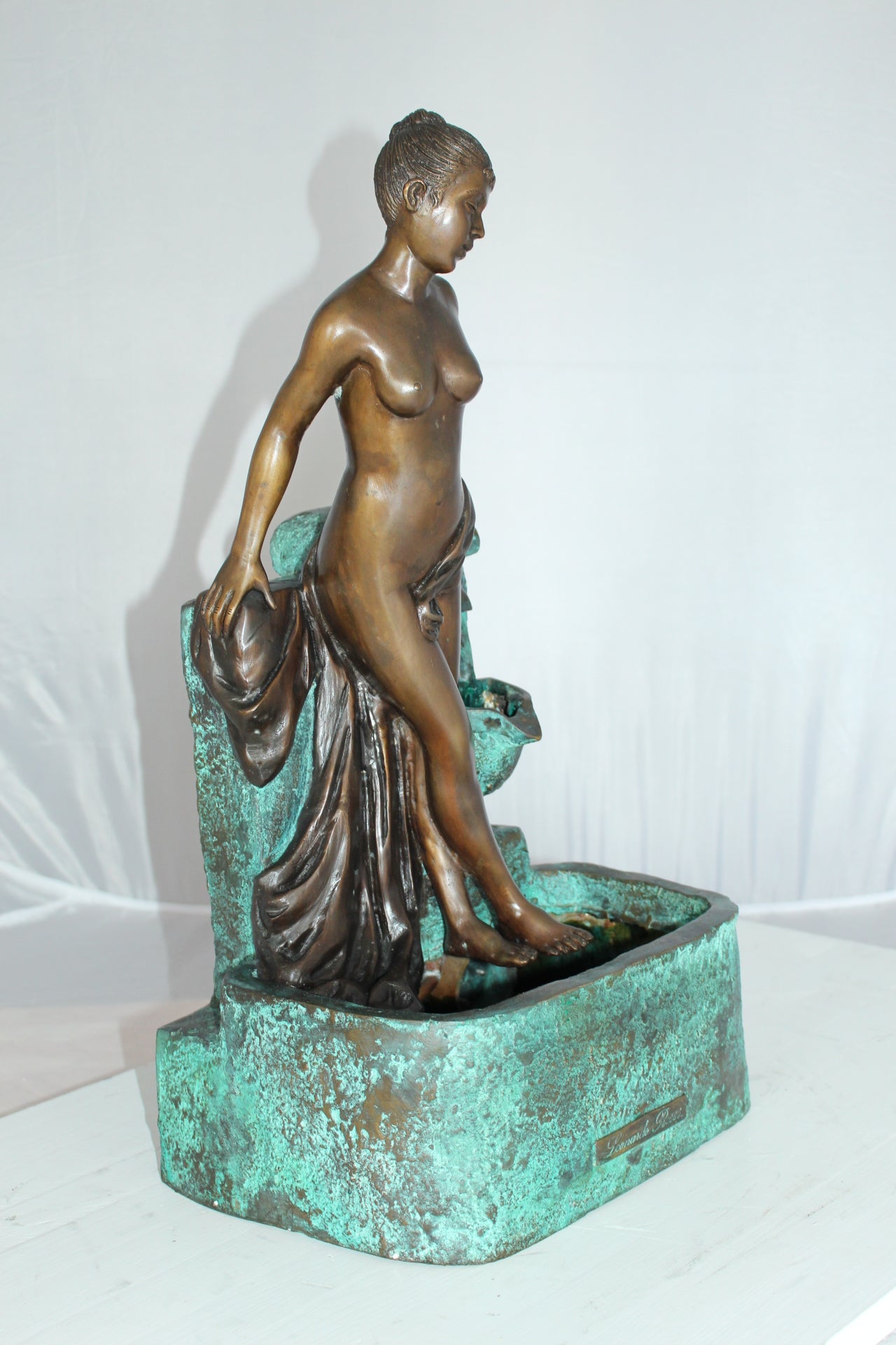 Lady on Wall fountain Bronze Statue - Size: 12"L x 9"W x 21"H.