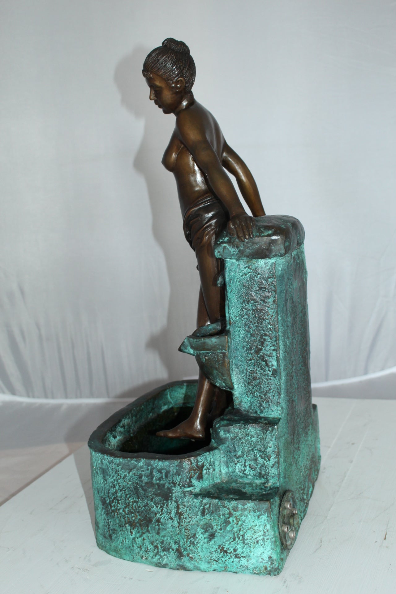 Lady on Wall fountain Bronze Statue - Size: 12"L x 9"W x 21"H.