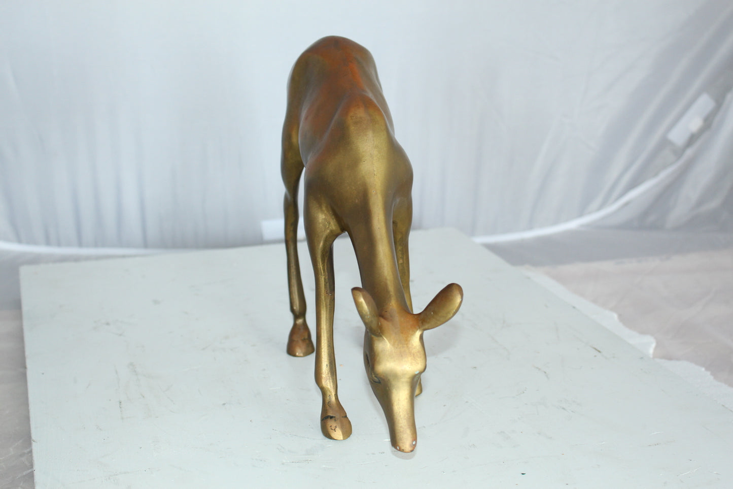 Two Tone color deer bronze statue - Size: 13"L x 4"W x 11"H.
