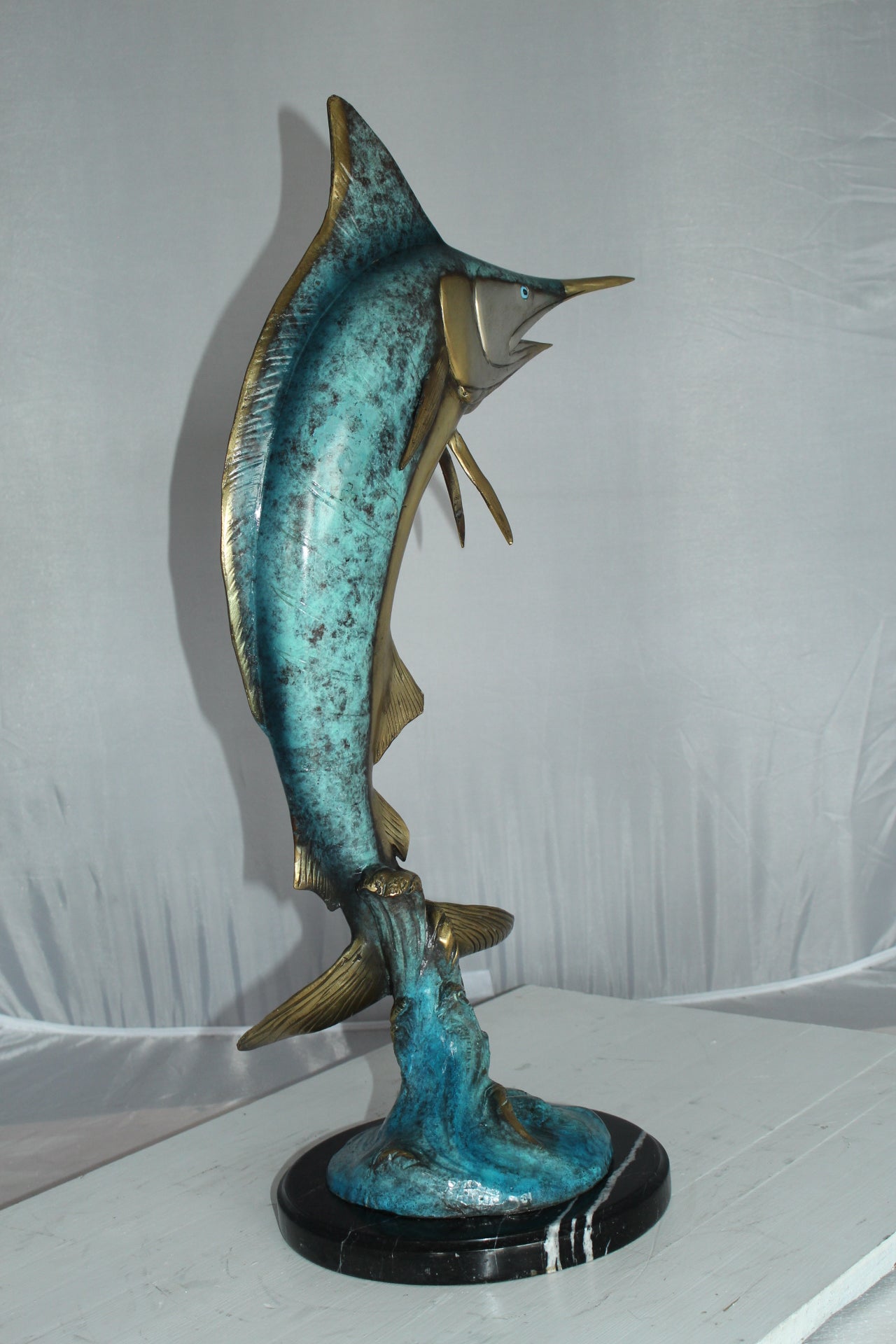 Single Marlin Fish bronze statue - Size: 9"L x 9"W x 27"H.