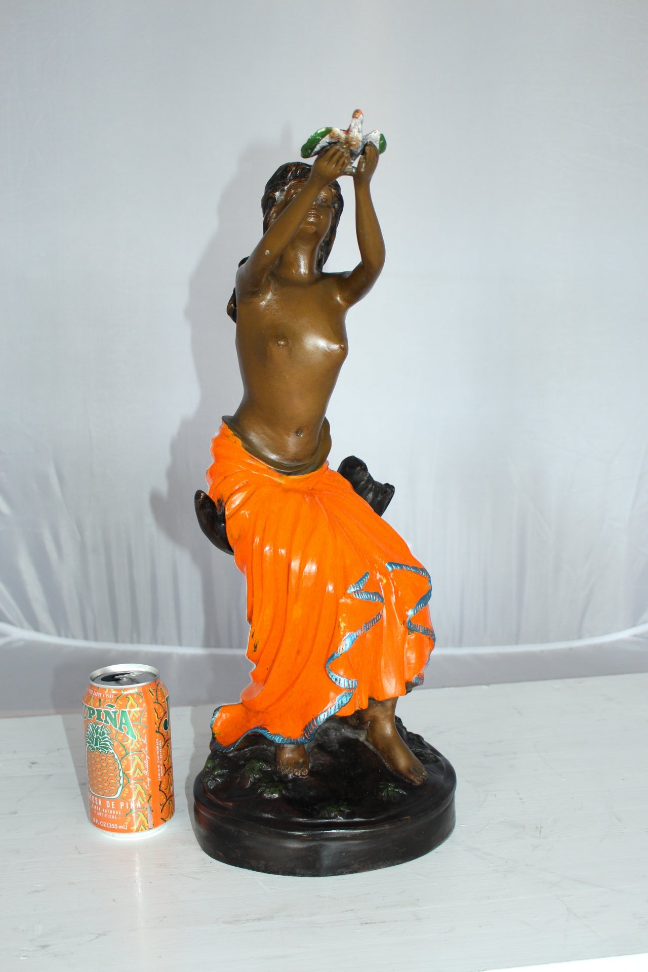 Lady Holds a Bird Up Bronze Statue - Size: 7"L x 7"W x 20"H.