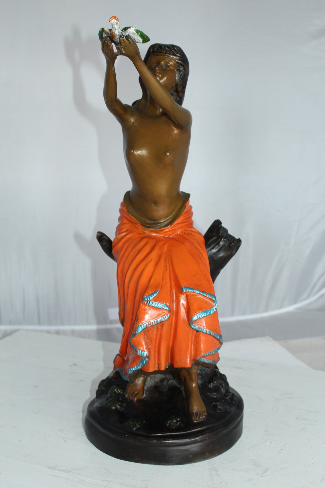 Lady Holds a Bird Up Bronze Statue - Size: 7"L x 7"W x 20"H.