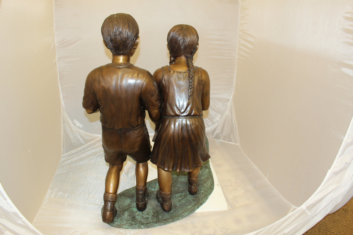 Two Kids Walking a dog Bronze Statue - Size: 55"L x 28"W x 37"H.