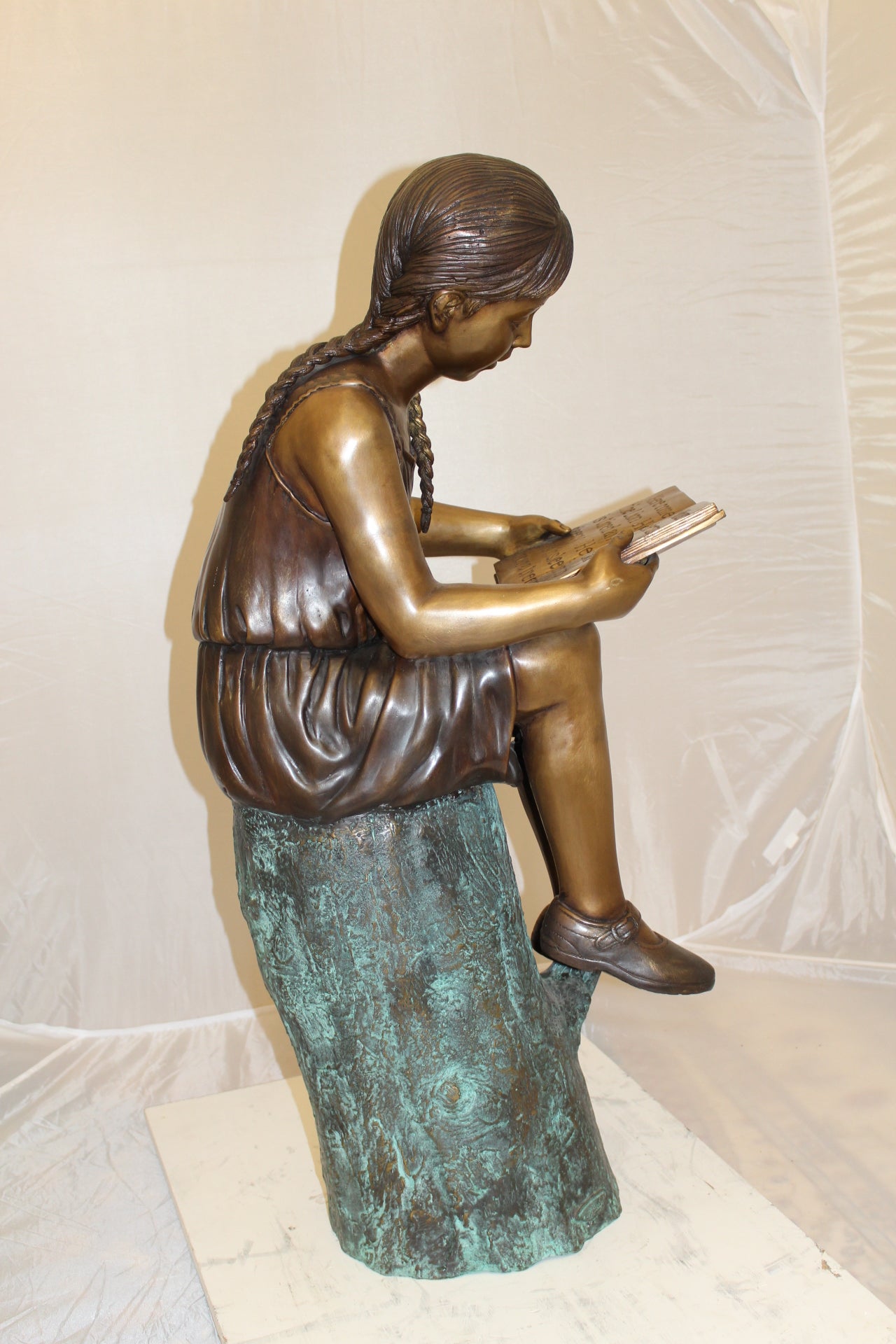 Girl Sitting on a Tree Stump Reading a Book Bronze Statue - 15"L x 17"W x 38"H