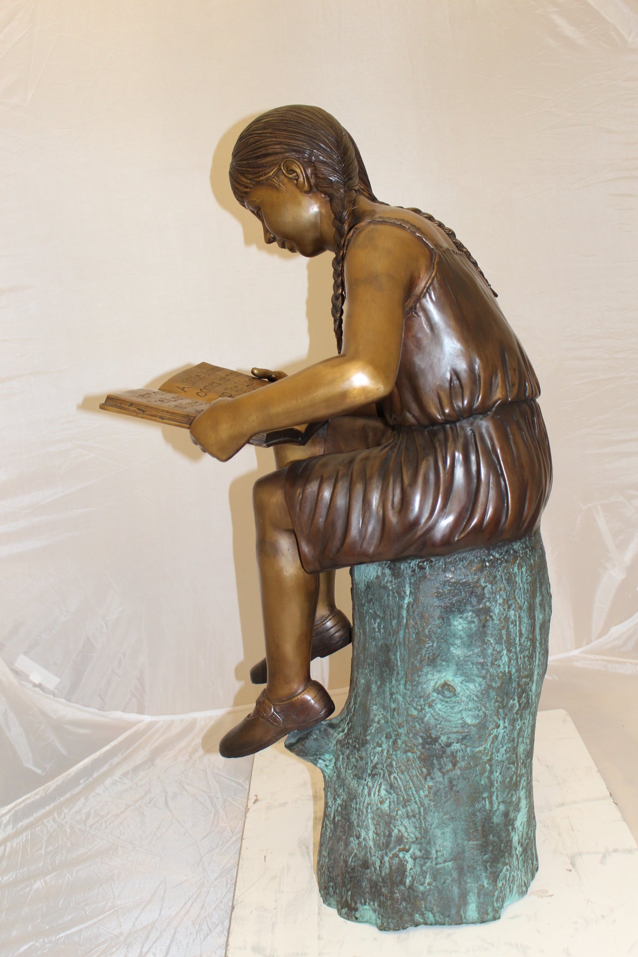 Girl Sitting on a Tree Stump Reading a Book Bronze Statue - 15"L x 17"W x 38"H