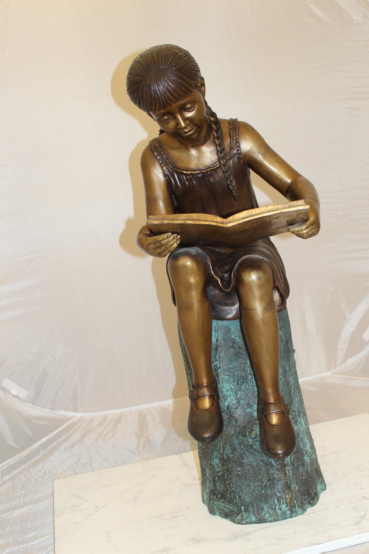 Girl Sitting on a Tree Stump Reading a Book Bronze Statue - 15"L x 17"W x 38"H