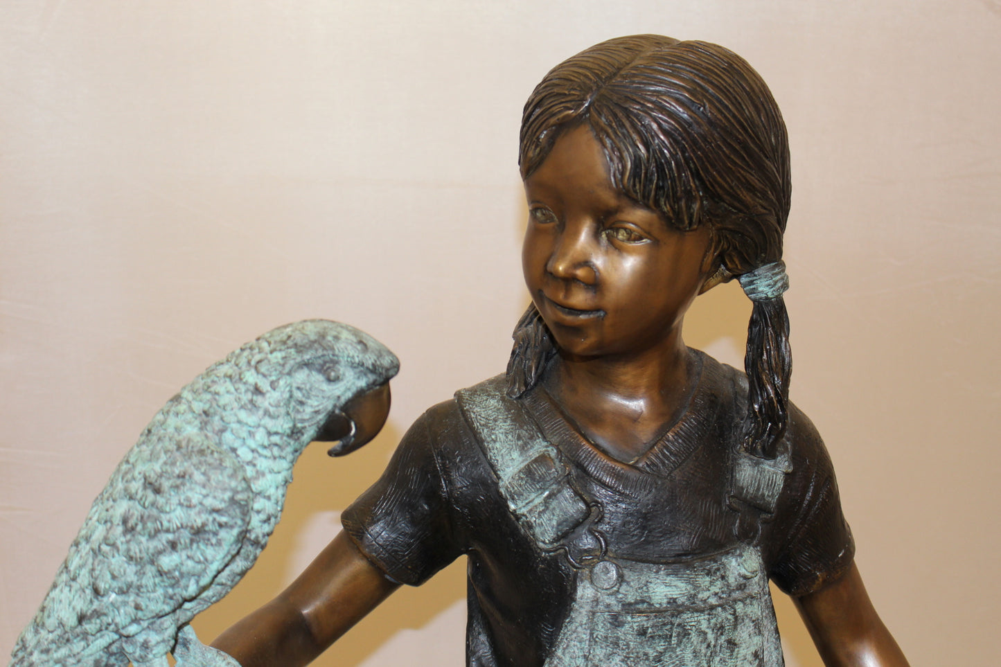 Girl Holding a Parrot Bronze Statue -  Size: 26"L x 19"W x 42"H.