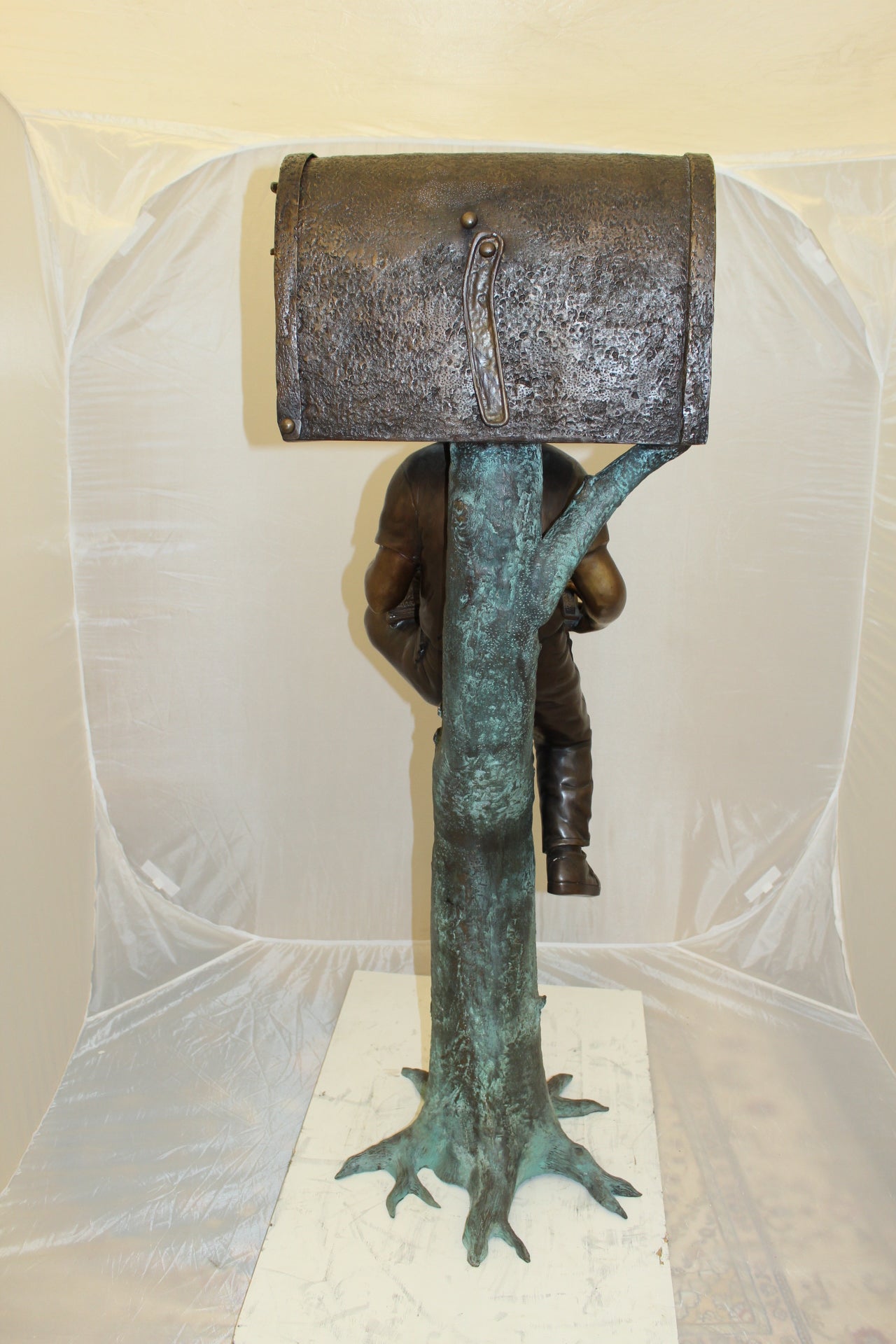 Boy Sitting by a Mailbox reading a book Bronze Statue - 16"L x 20"W x 50"H.