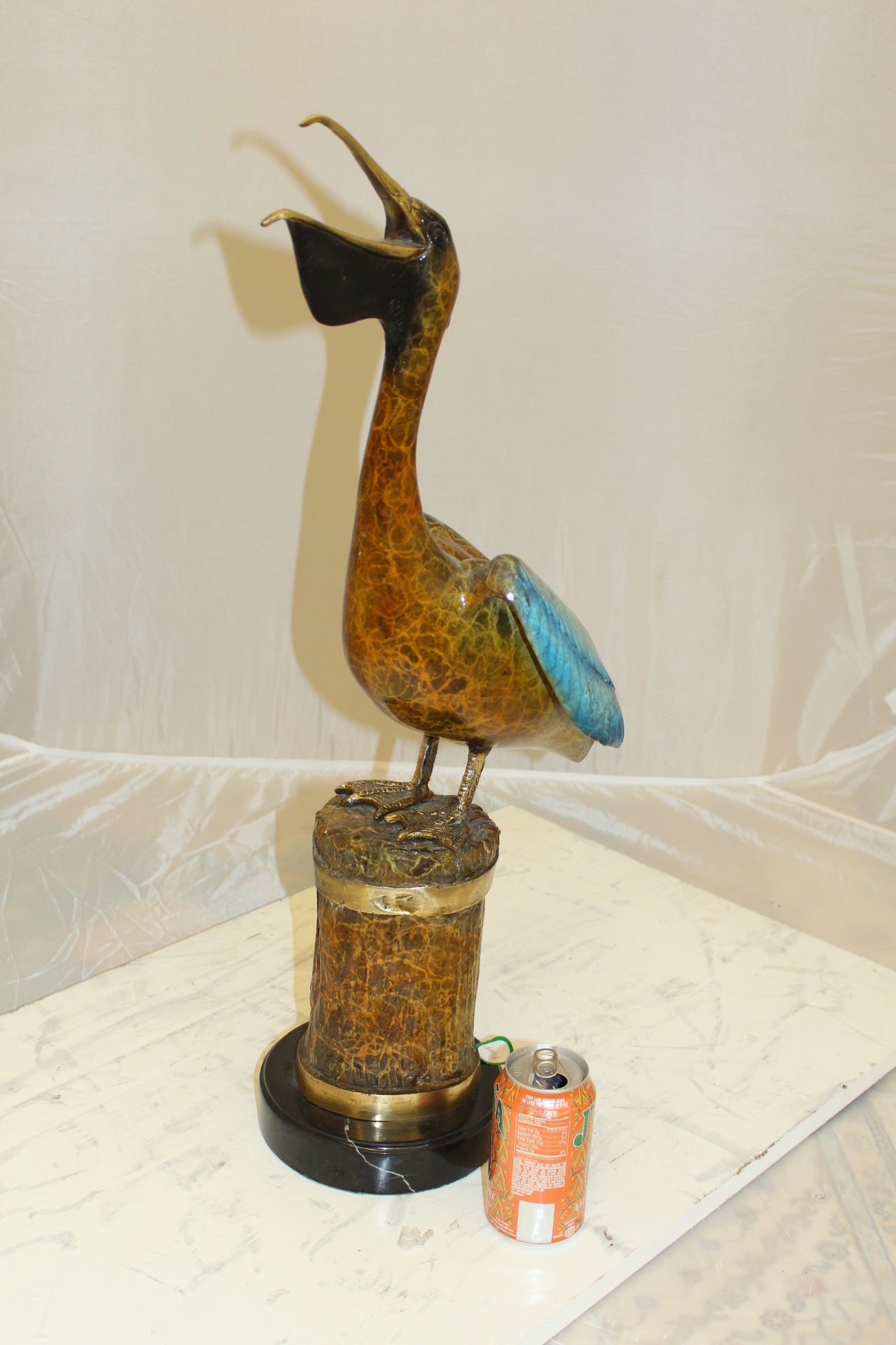 Pelican on a Tree Stump Bronze Statue - Size: 8"L x 12"W x 27"H.