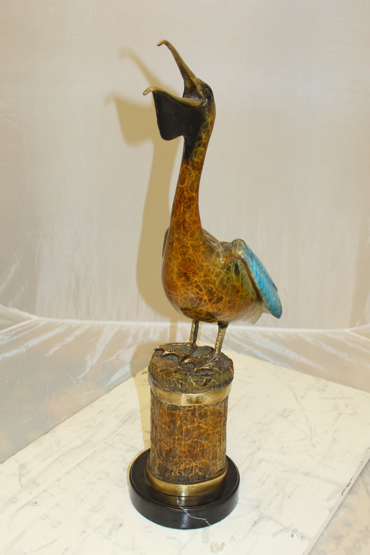 Pelican on a Tree Stump Bronze Statue -  Size: 8"L x 12"W x 27"H.