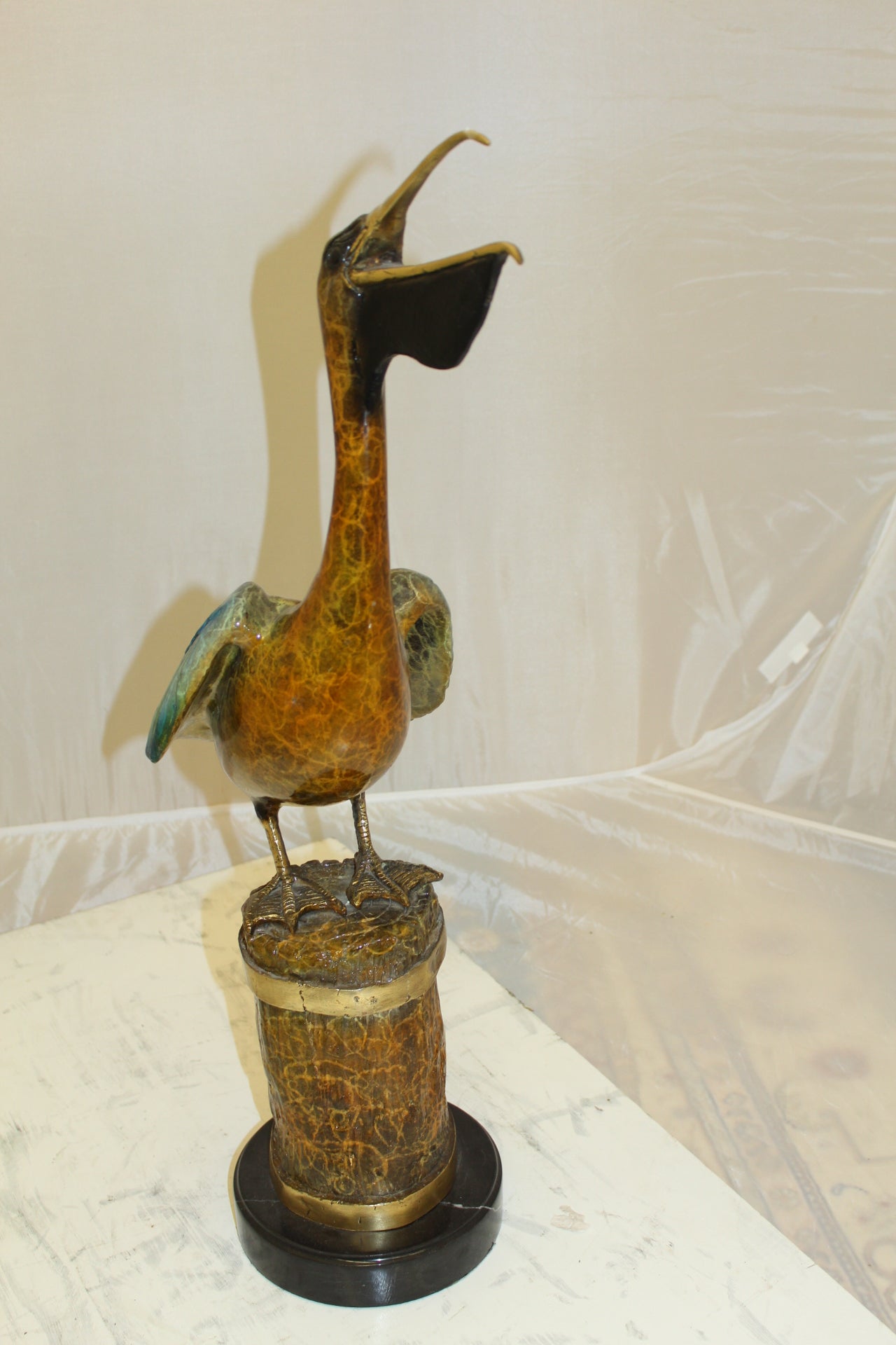 Pelican on a Tree Stump Bronze Statue - Size: 8"L x 12"W x 27"H.