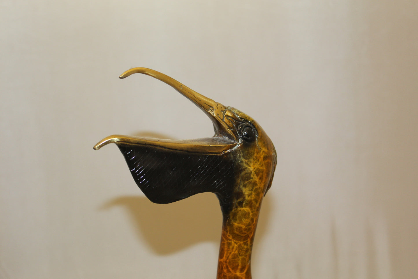 Pelican on a Tree Stump Bronze Statue -  Size: 8"L x 12"W x 27"H.