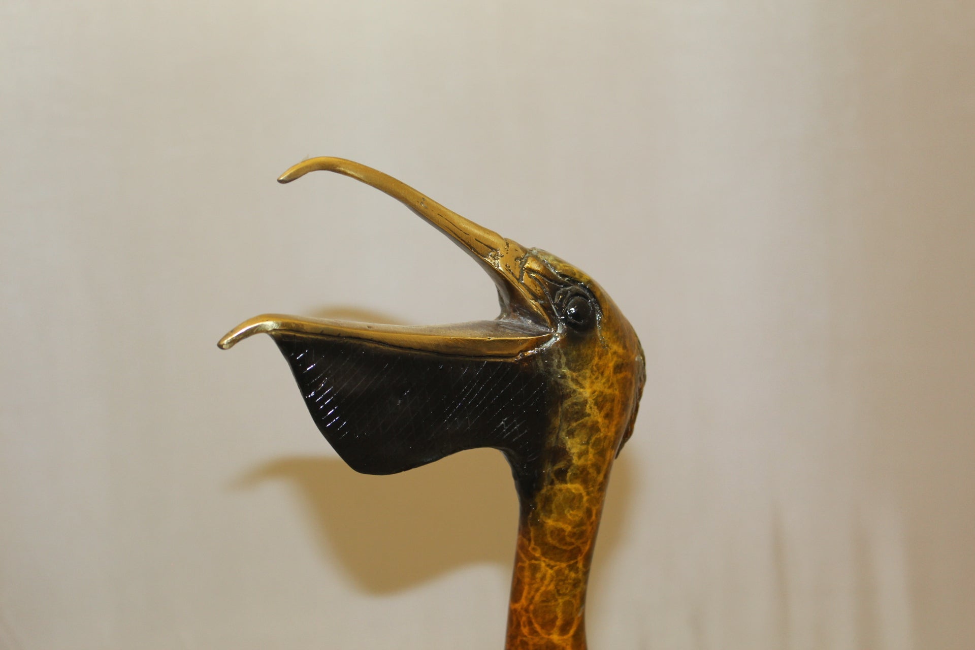 Pelican on a Tree Stump Bronze Statue -  Size: 8"L x 12"W x 27"H.